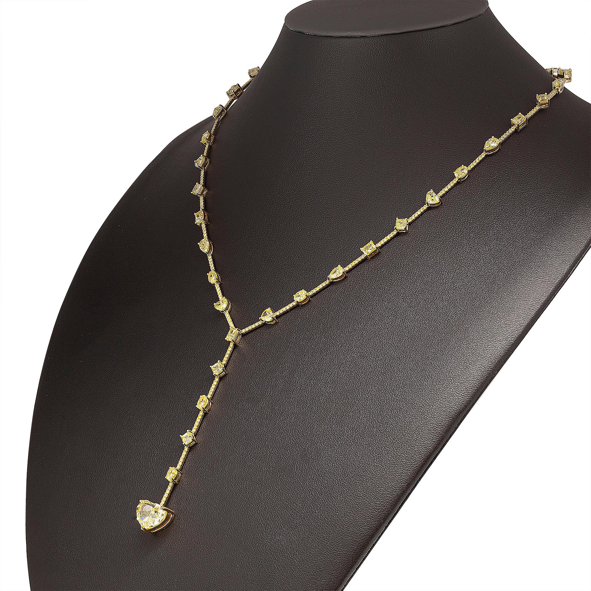 Fancy Yellow Diamond Lariat Tennis Necklace in 18K Yellow Gold

Center stone: 5.02ct Fancy Yellow VVS2 Heart Shape Brilliant GIA#7398890363 

Featuring Mixed Fancy Shape diamonds:
8st Fancy Yellow asscher cuts totaling 3.07ct 
8st heart shapes 