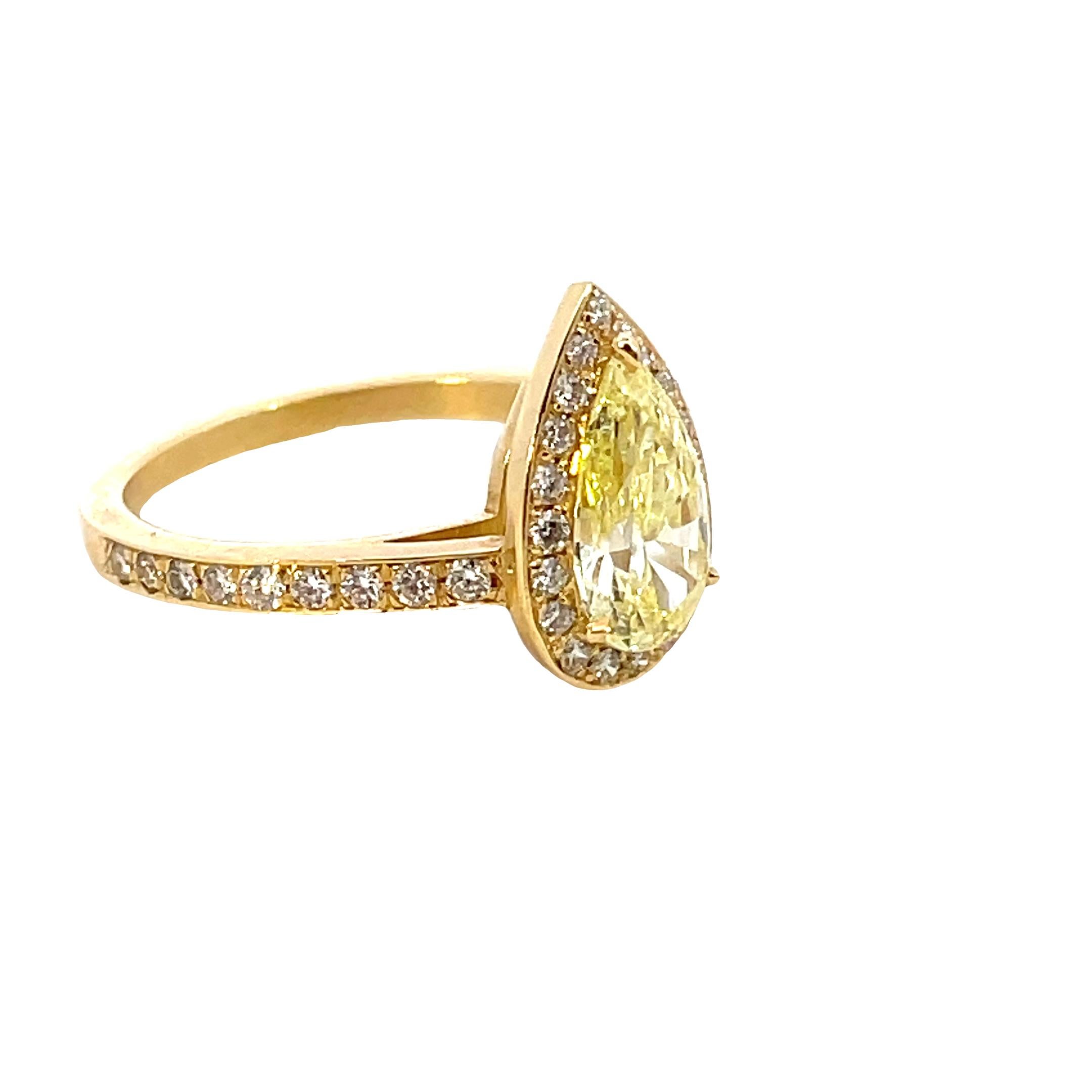 1.20 cts Fancy Yellow Diamond Ring Pear Shape, surrounded by White round diamonds; Mounting Made in Italy the ring is brand new.
Comes wit a Fitted Box
