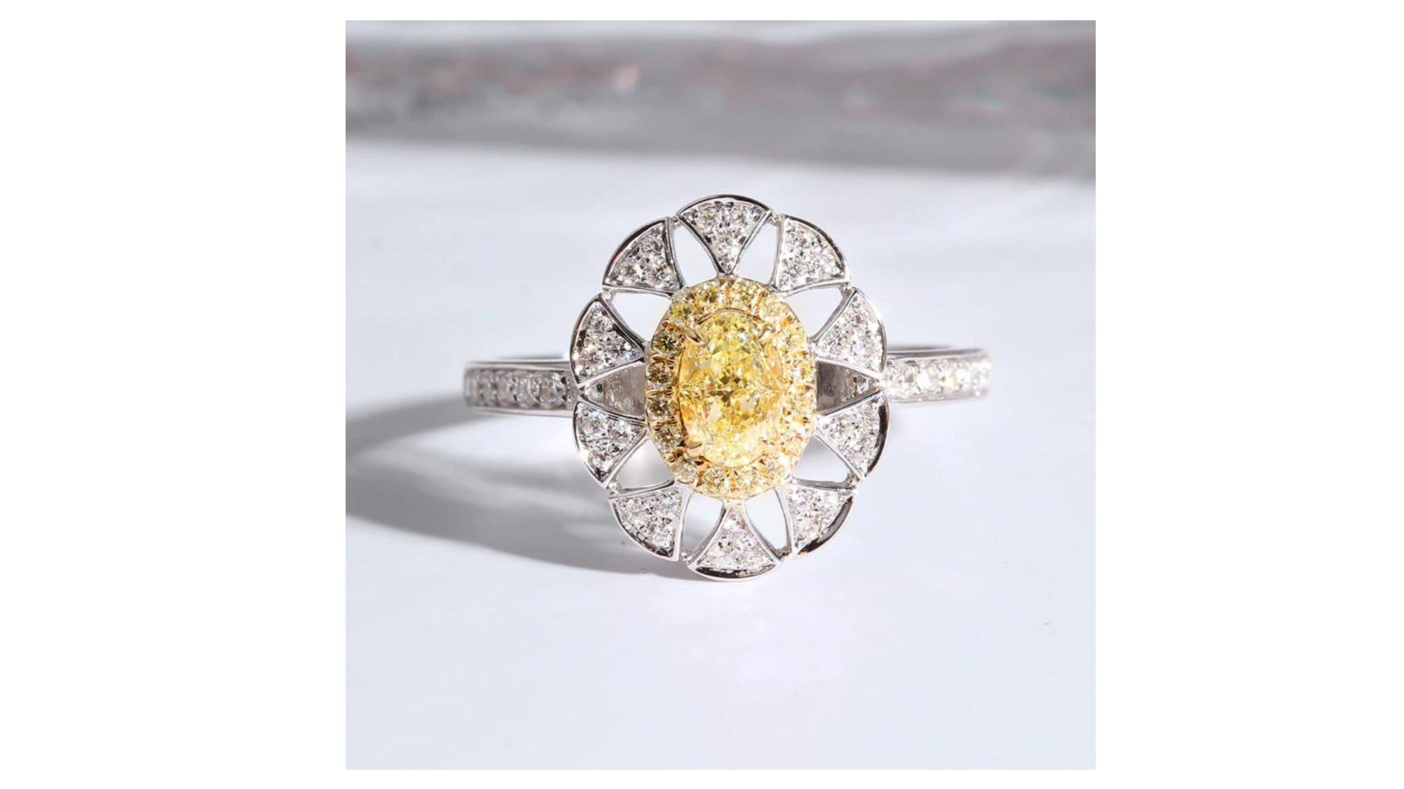 

This Fancy Yellow diamond ring stands out with 37 diamonds set in 18 Karat White Gold. 


Diamonds: Natural Diamonds

Mainyellowdiamond: 0.4ct

Assistant diamond:0.5ct

allCarat Weight: 0.9ct

Cut: Oval shape
Clarity: SI
Color: G-F


