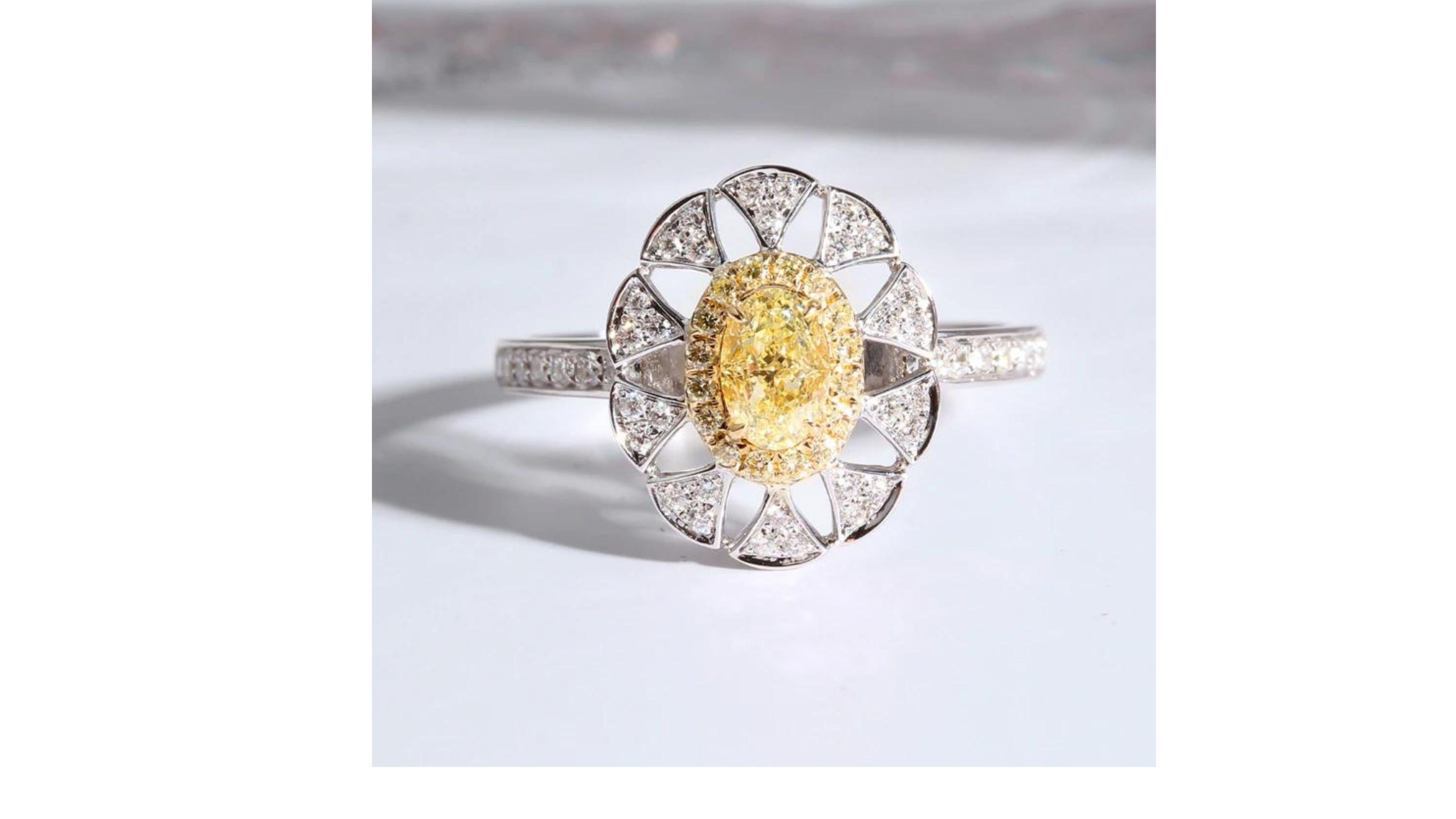 Oval Cut Fancy Yellow Diamond Ring 18 Karat White Gold For Sale