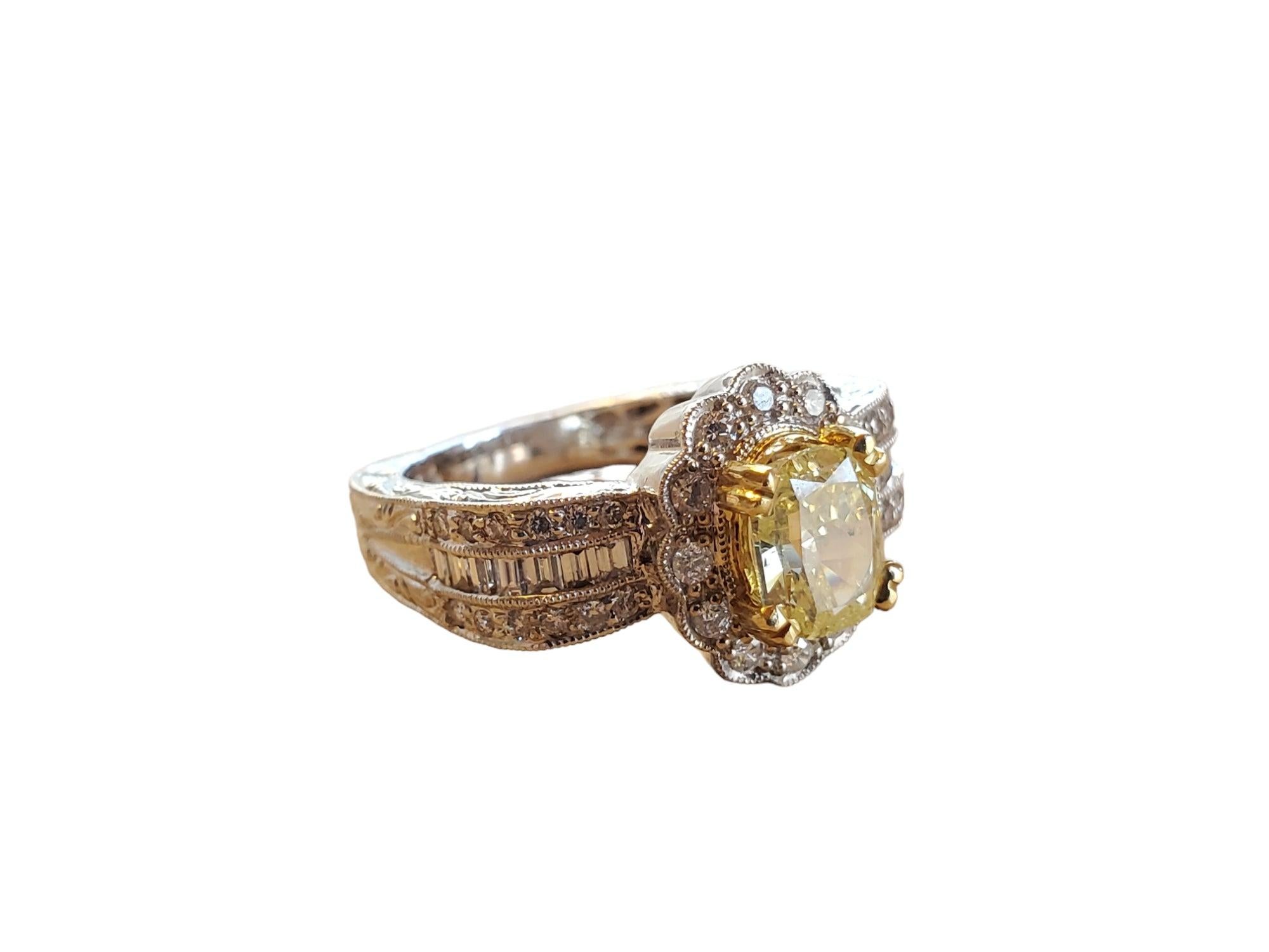 This listing is for an unworn closeout 18k white gold beautiful diamond ring. The center light yellow SI2-I1 diamond is a 1.65ct cushion with .24tcw fancy yellow diamonds and .39tcw white vs diamond halo. This gorgeous ring would make an amazing