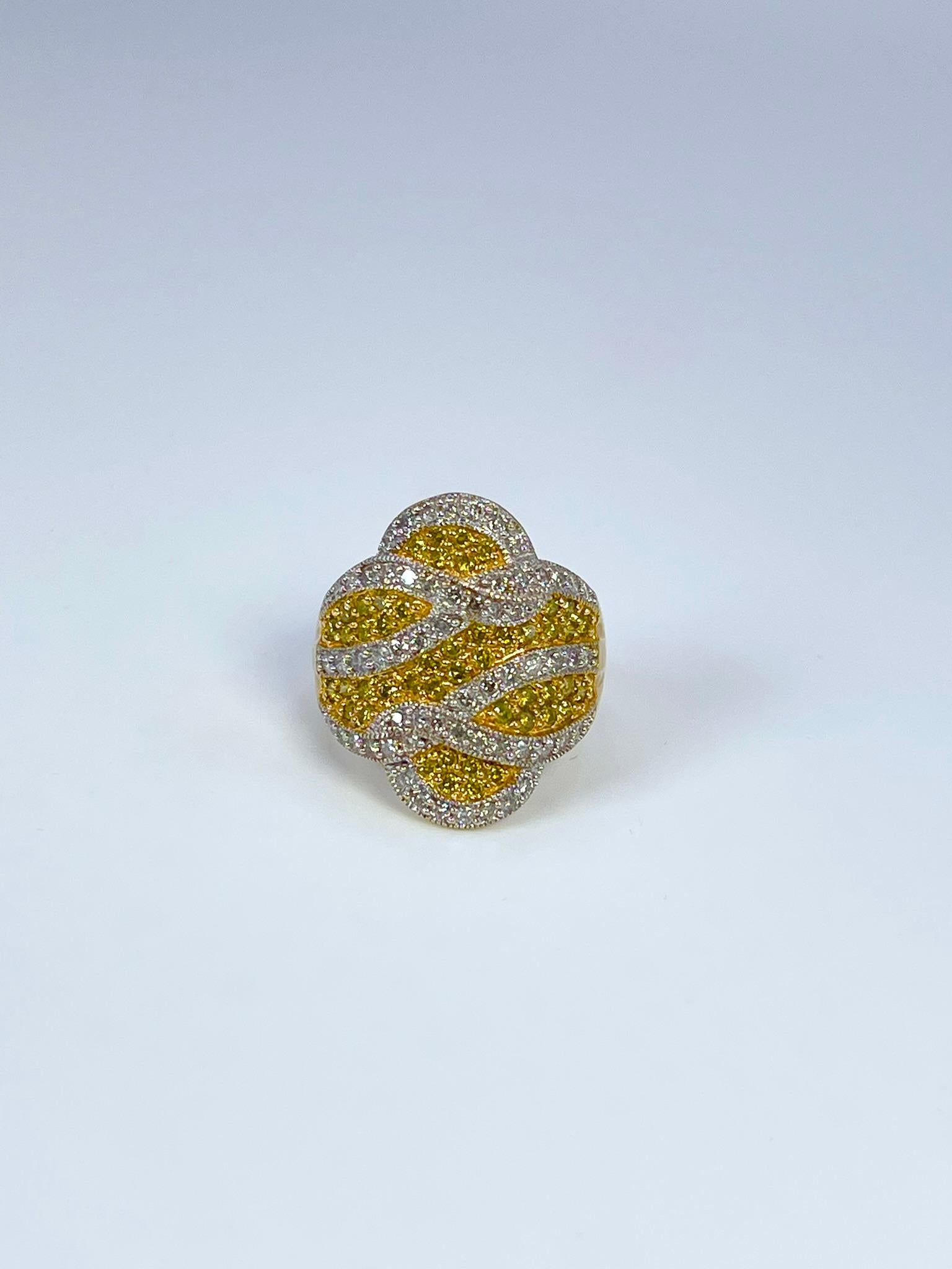 Beautifully crafted fancy yellow diamond cocktail diamond ring in 14KT yellow gold.

GRAM WEIGHT: 6.24gr
METAL: 14KT yellow gold

NATURAL DIAMOND(S)
Cut: Round Brilliant 
Color: Fancy Yellow(NATURAL), White (G-H)
Clarity: SI
Carat: 1.28ct
Size: