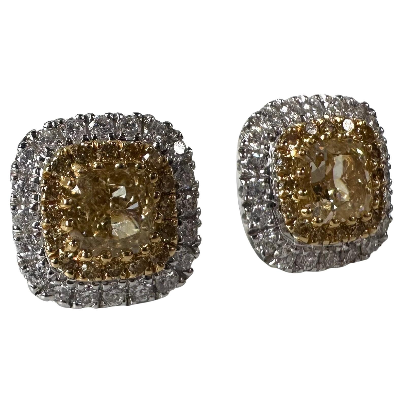Fancy yellow diamond earrings, made with excellent craftsmanship. The double halo in fancy yellow and white diamonds style is stunning and makes the center stone look bigger and stand out! 

GOLD: 18KT gold
NATURAL DIAMOND(S)
Clarity/Color:
