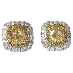 Fancy yellow diamond stud earrings 18KT 1.46ct Double halo stud earrings