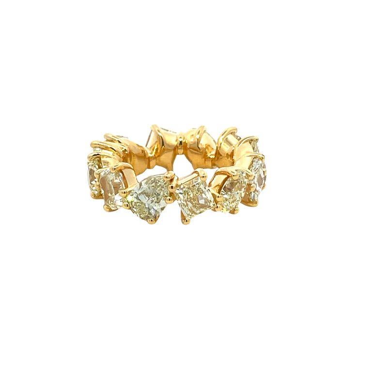 We are thrilled to introduce to you our latest diamond fancy-shape eternity band. This band is unique because of the perfect balance between its different diamond shapes. It has twelve stones in yellow color and a clarity grade of VS with a total of