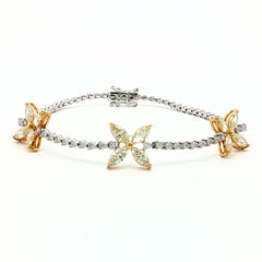 Fancy Yellow Marquise and White Diamond Victoria Motif Tennis Bracelet 18K Gold