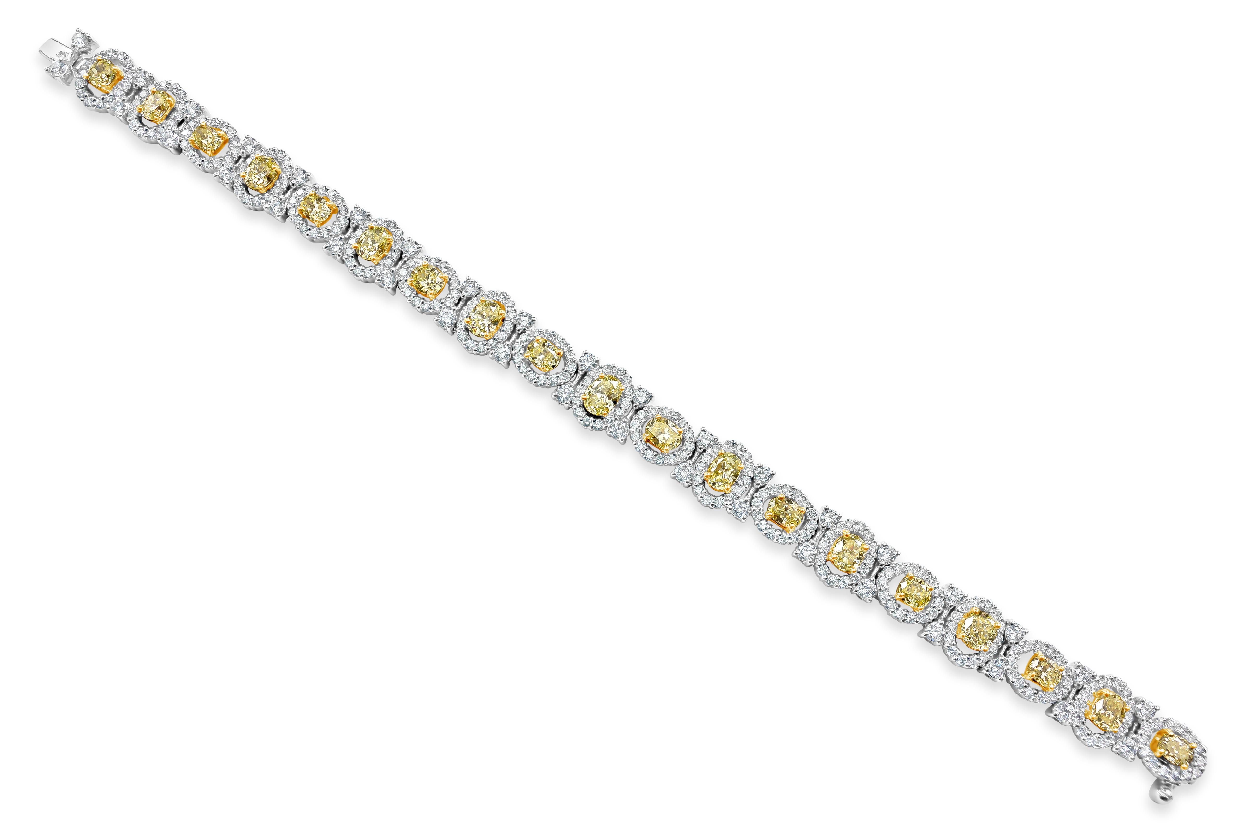 An elegant piece of jewelry beautifully showcasing 19 fancy yellow oval cut diamonds set in an open-work halo accented with round brilliant diamonds. Fancy yellow diamonds weigh 6.21 carats total; accent diamonds weigh 5.29 carats total. Made in 18K