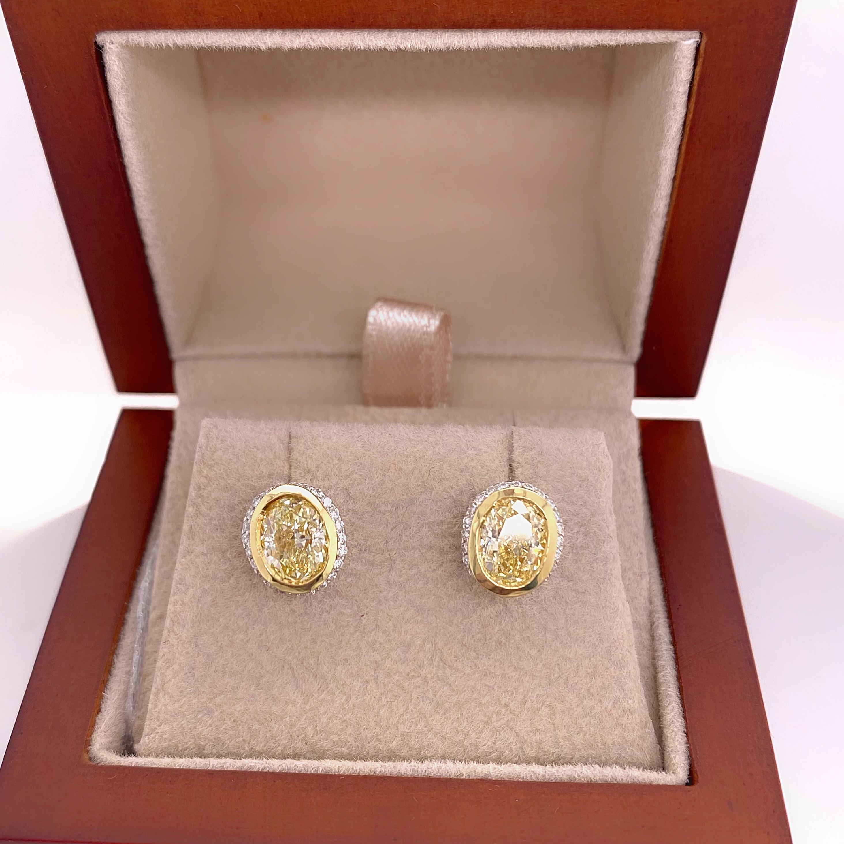 Fancy Yellow Oval Diamond 2.25 tcw Earrings Bezel Set in 18kt Yellow Gold Plat In Excellent Condition For Sale In San Diego, CA