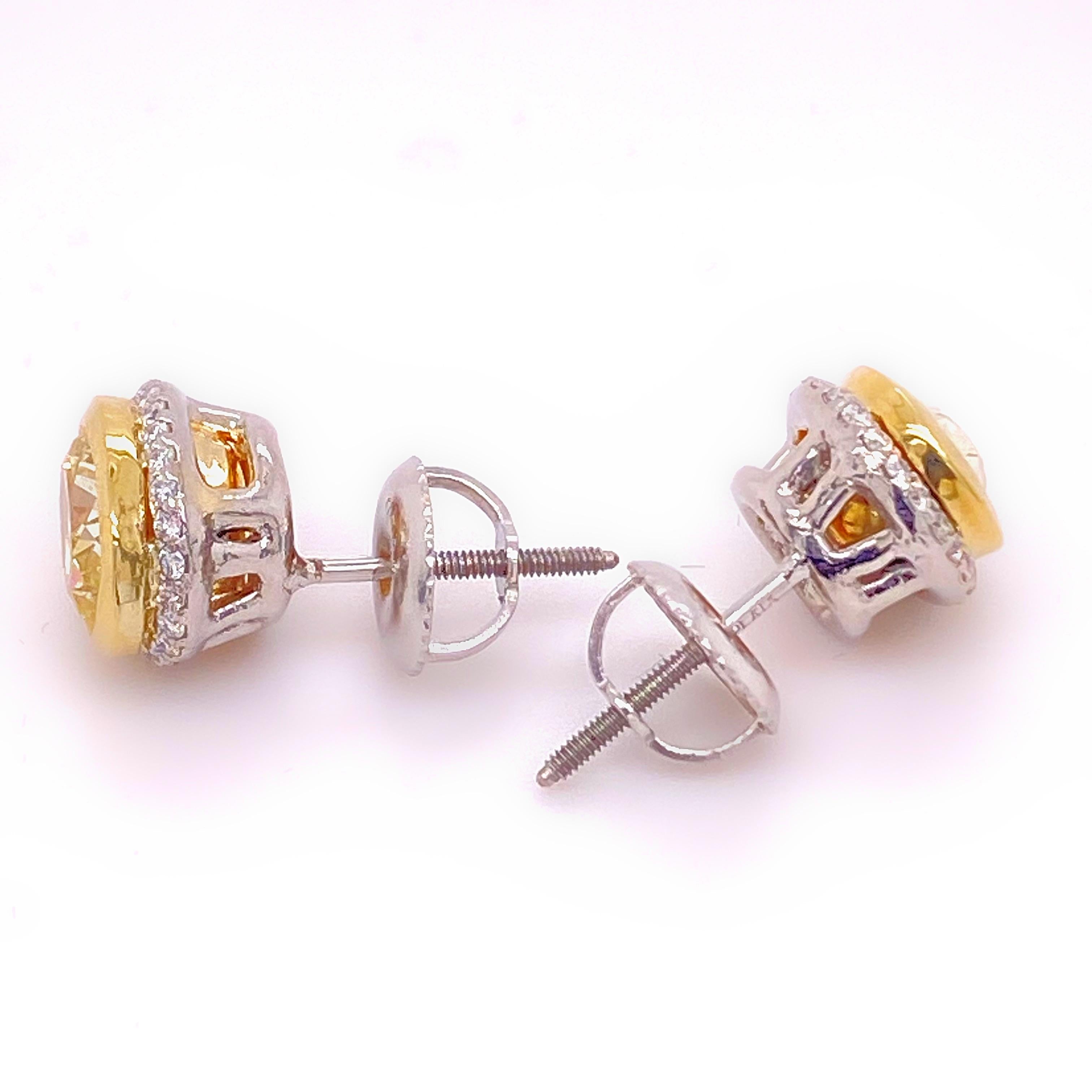 Fancy Yellow Oval Diamond 2.25 tcw Earrings Bezel Set in 18kt Yellow Gold Plat For Sale 1