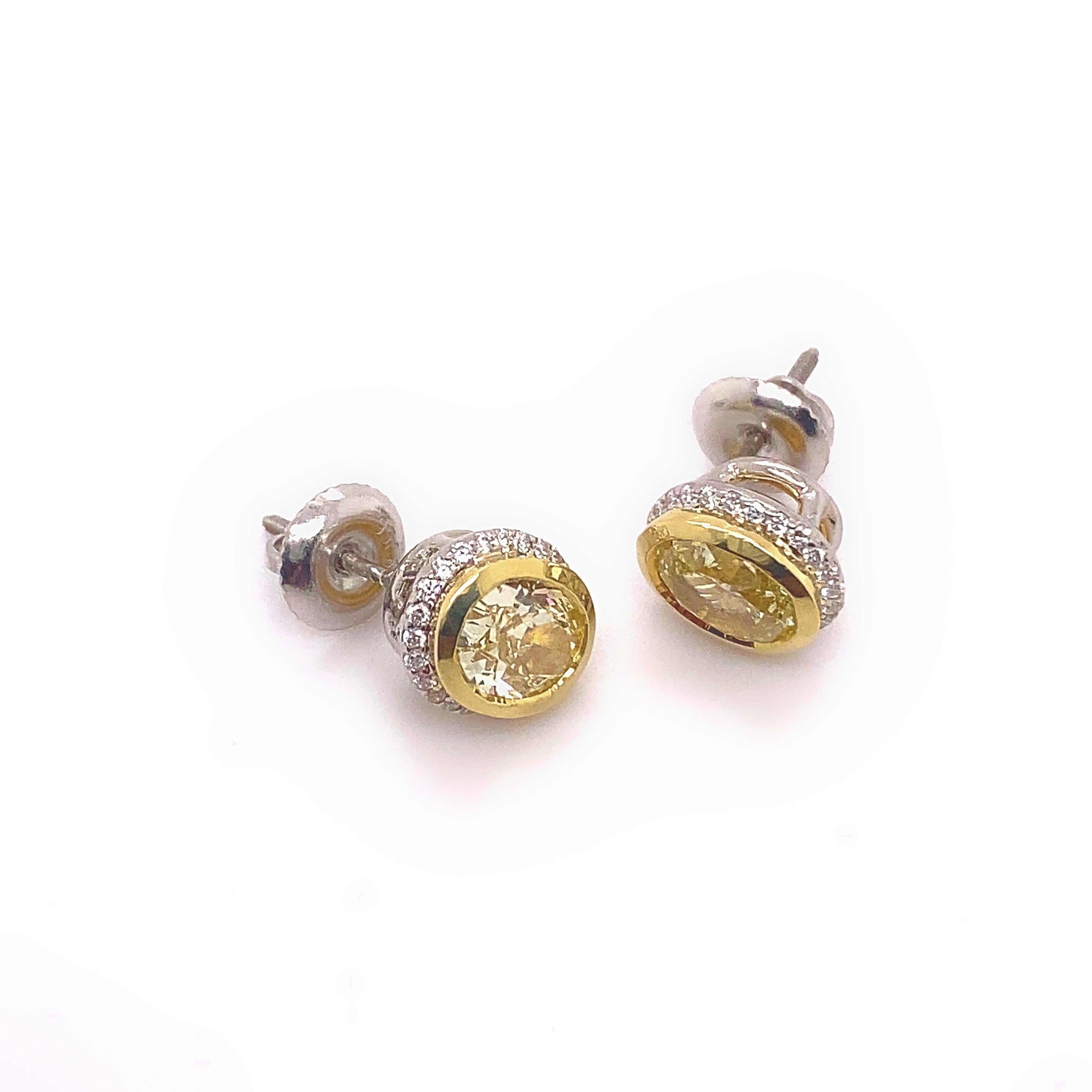 Fancy Yellow Oval Diamond 2.25 tcw Earrings Bezel Set in 18kt Yellow Gold Plat For Sale 3