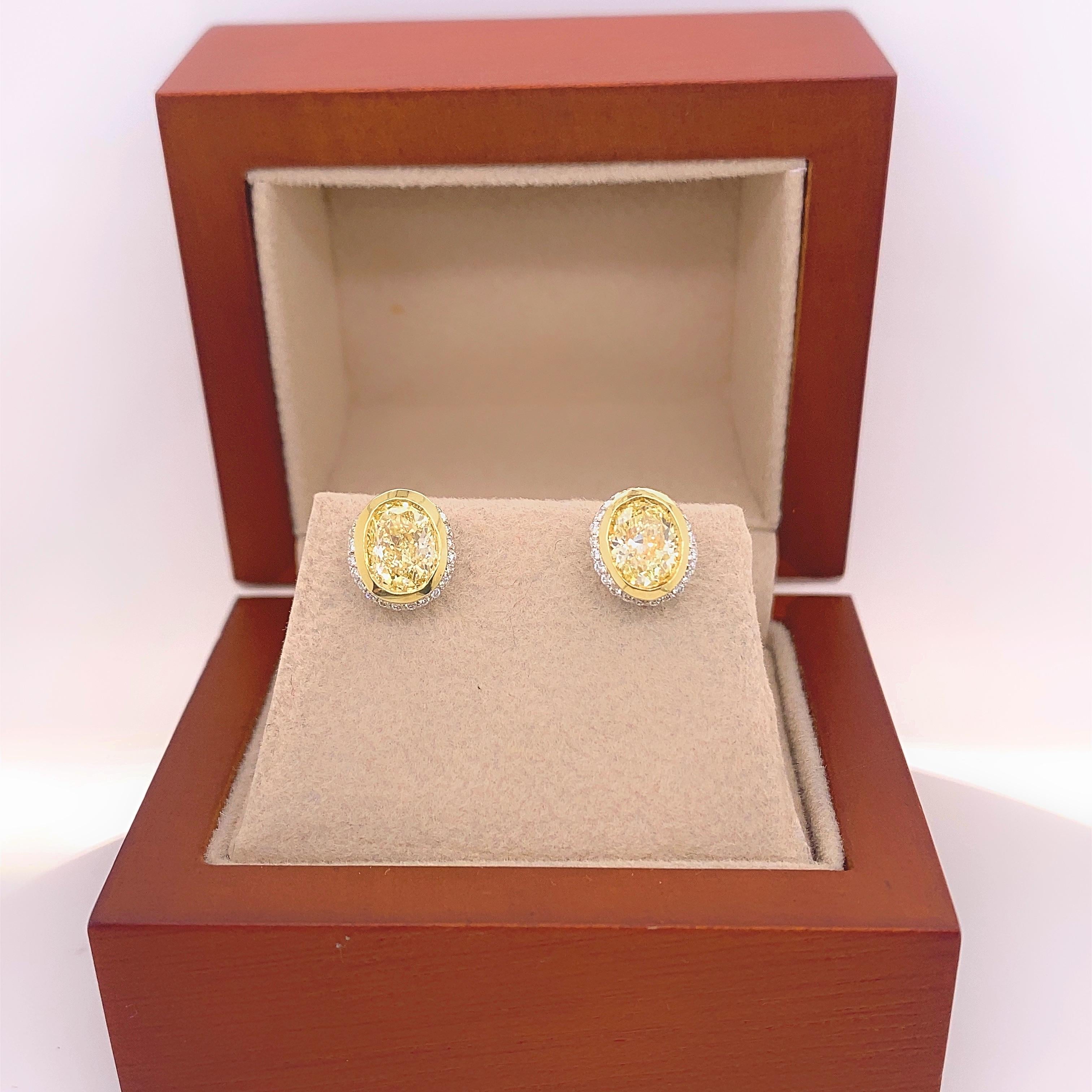 Fancy Yellow Oval Diamond 2.25 tcw Earrings Bezel Set in 18kt Yellow Gold Plat For Sale 4