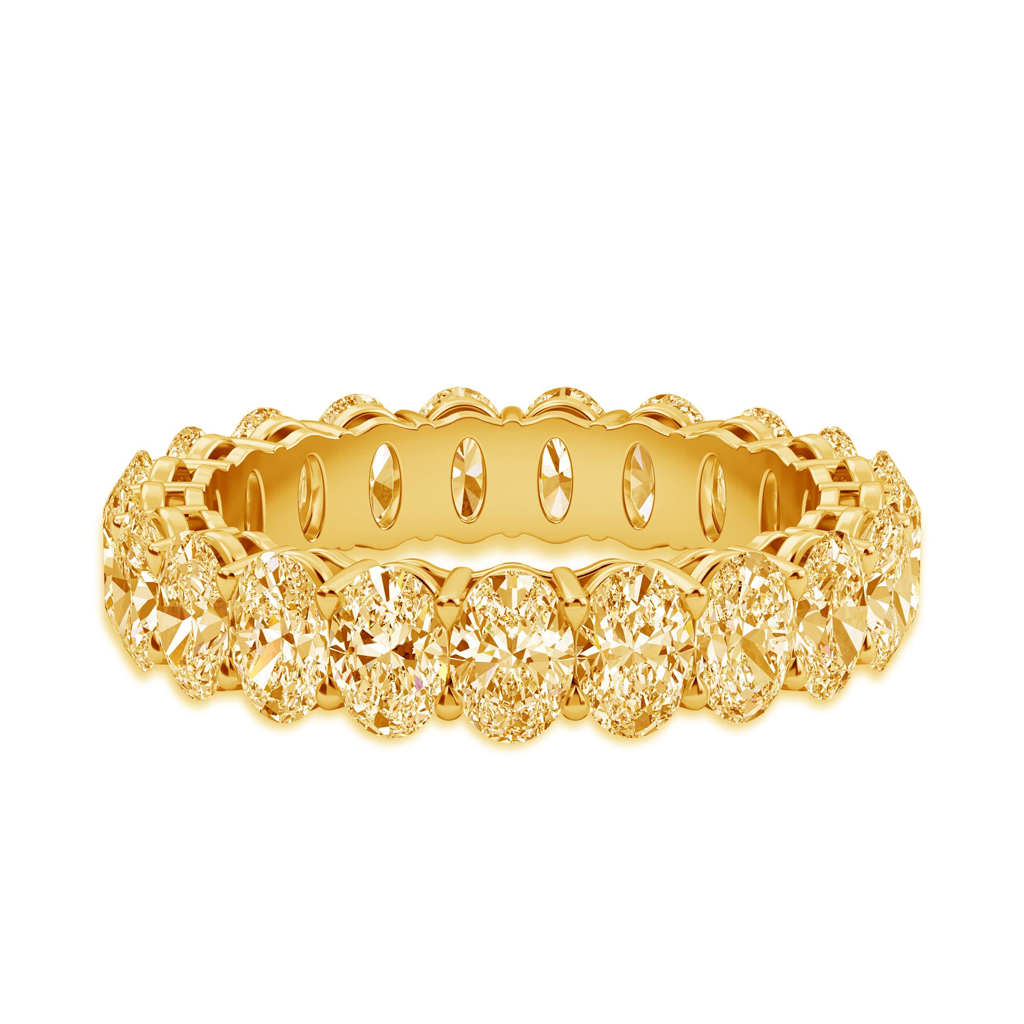 This Oval Band has 21 Diamonds with a total carat weight of 5.48. 
The diamonds are Fancy Intense Yellow Color VS clarity. 
The ring is a finger size 6.5 and is set in 18K Yellow Gold.