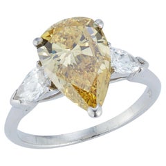 Fancy Yellow Pear Diamond Three-Stone Ring with Pear Diamond Accents