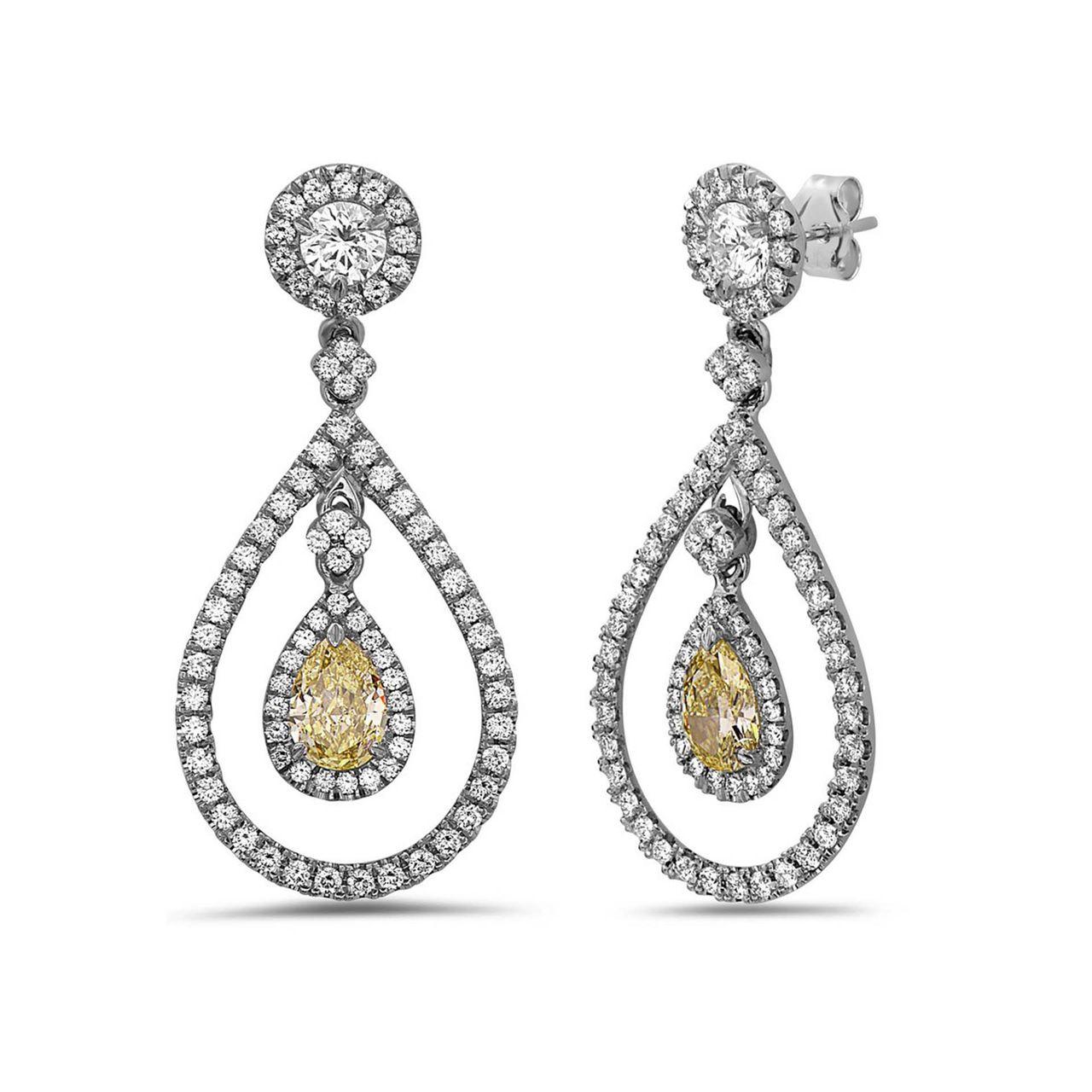 Ladies elegant Diamond drop earrings
 2 Pear-shaped Diamonds 0.85 carat Fancy Yellow 
Total Weight Surrounded by 1.00 carat round brilliant Diamonds VS clarity F\G color
 2 round shaped diamonds on top 0.20 carat each 
Earrings are mounted in