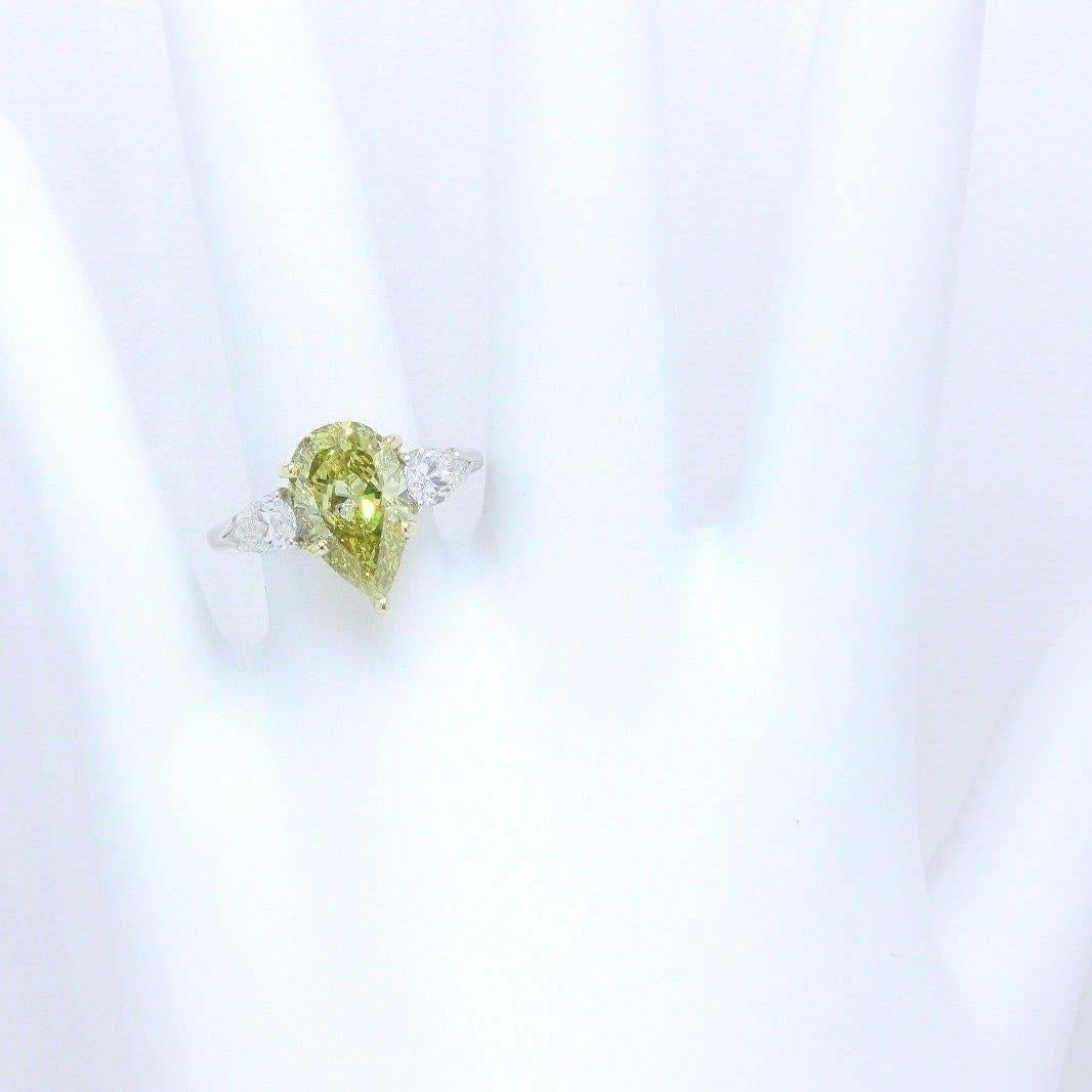 Round & Pear Shape Three Stone Ring in 18ct Yellow & White Gold