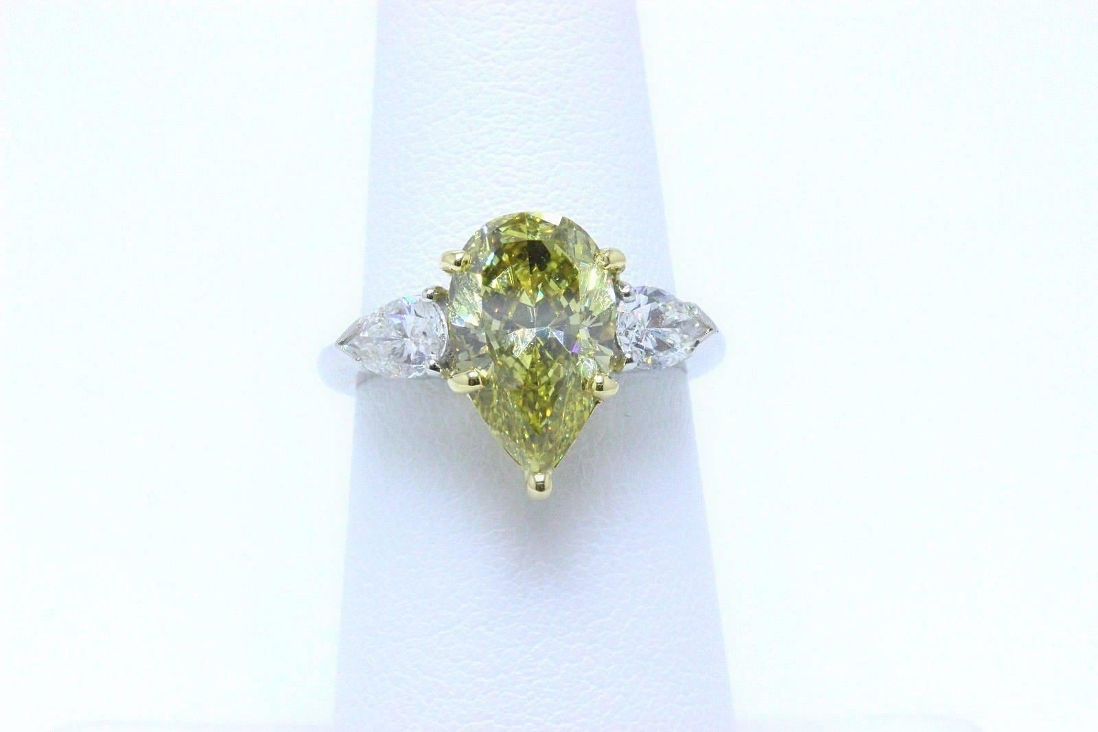 Fancy Yellow Pear Shape Three Stone 3.82TCW Diamond Engagement Ring in 18k GIA In Excellent Condition In San Diego, CA