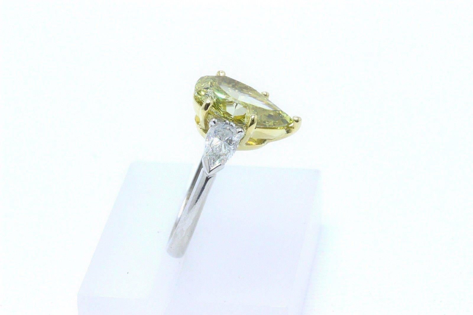 Women's Fancy Yellow Pear Shape Three Stone 3.82TCW Diamond Engagement Ring in 18k GIA