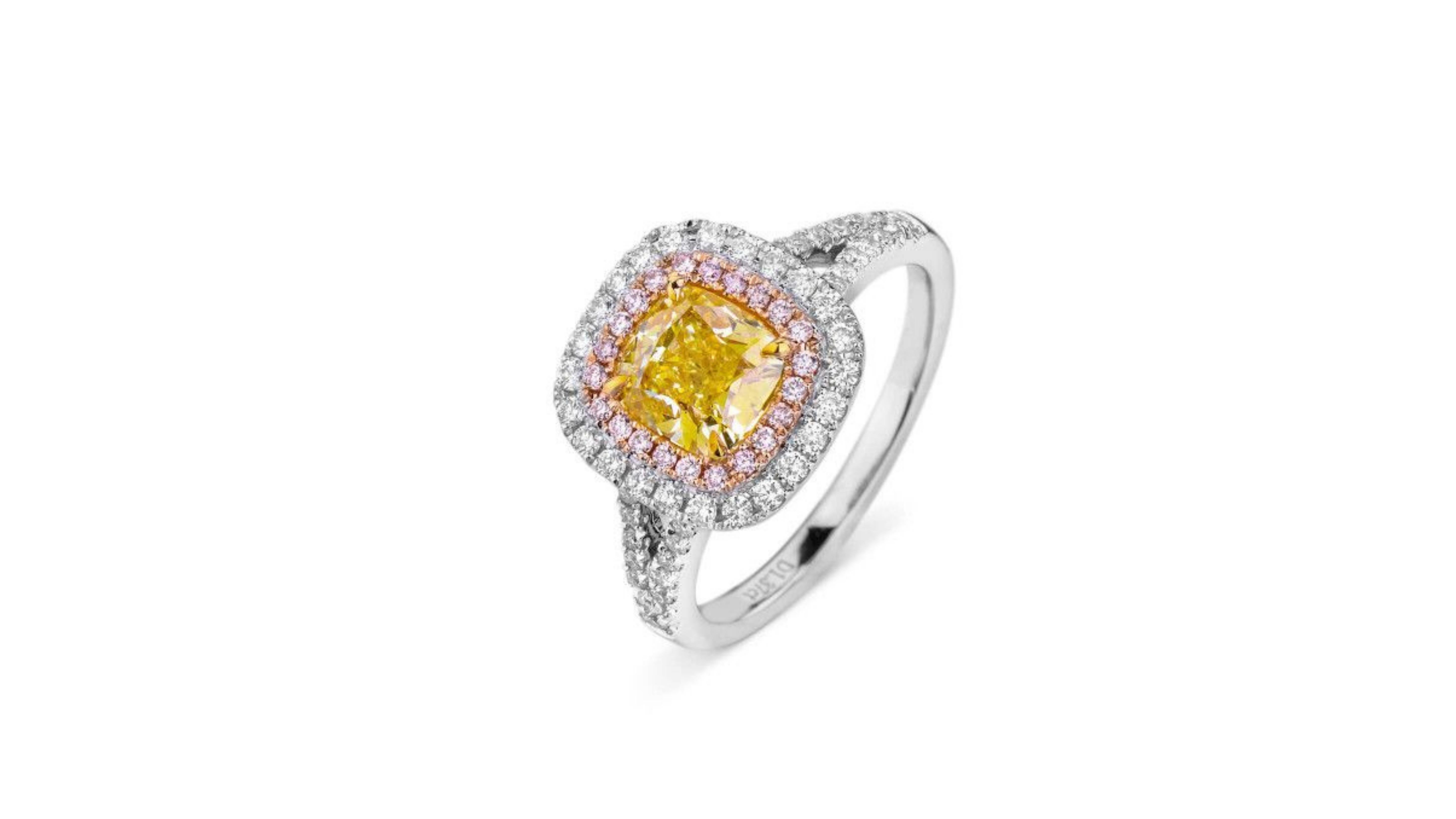 
This is a  1.37-Carat Cushion Cut Fancy Yellow VS2  set in  18K Gold with 52 Brilliant G-H VS Natural Diamonds Totaling 0.36 Carats and 22 Brilliant Fancy Pink VS Diamonds with a GIA Certificate .  Very unique and if you are looking for anything