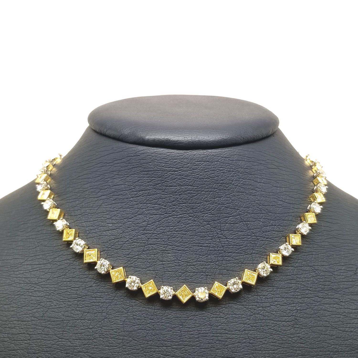 Fancy Yellow Princess Cut and Round Brilliant Diamonds set in a platinum and 18k yellow gold necklace
13.91 carats total weight 
