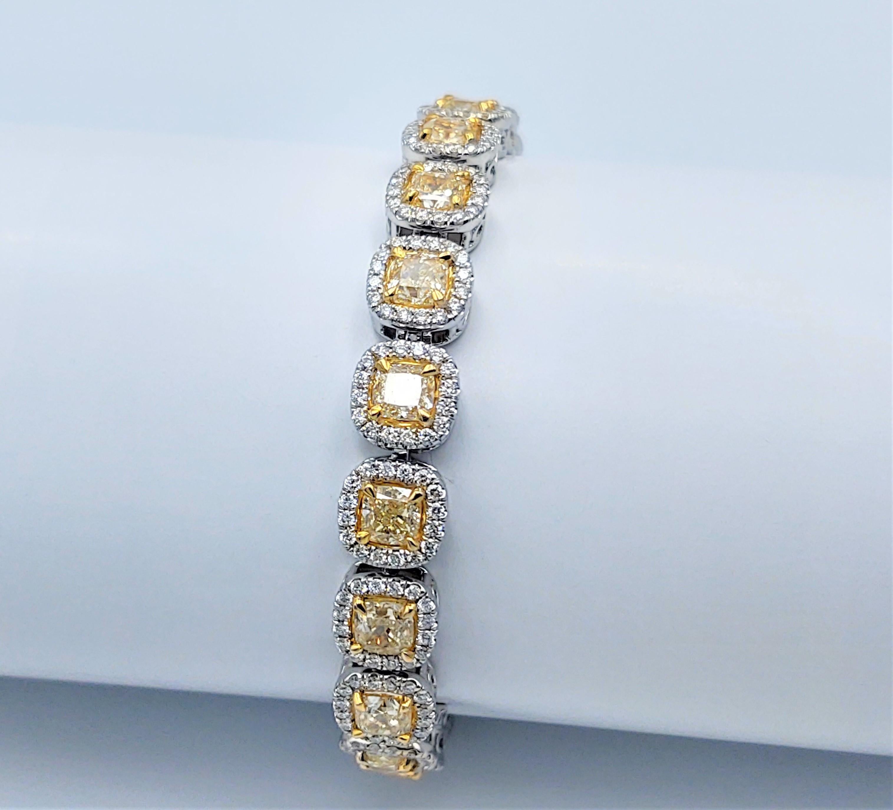 18K  White gold Fancy Yellow and White Diamond Tennis Bracelet  40.18 gr

Containing 20 Natural Fancy Yellow VS2+ Radiant  Cut Diamonds Weighing  14.60 cts. 

Each Stone Is Surrounded  By a Halo Consisting Of  320 White G+ SI + Round Brilliant