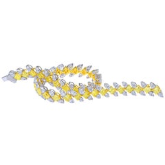 Fancy Yellow Radiant and White Pear Tennis Bracelet, 10.768 Carat