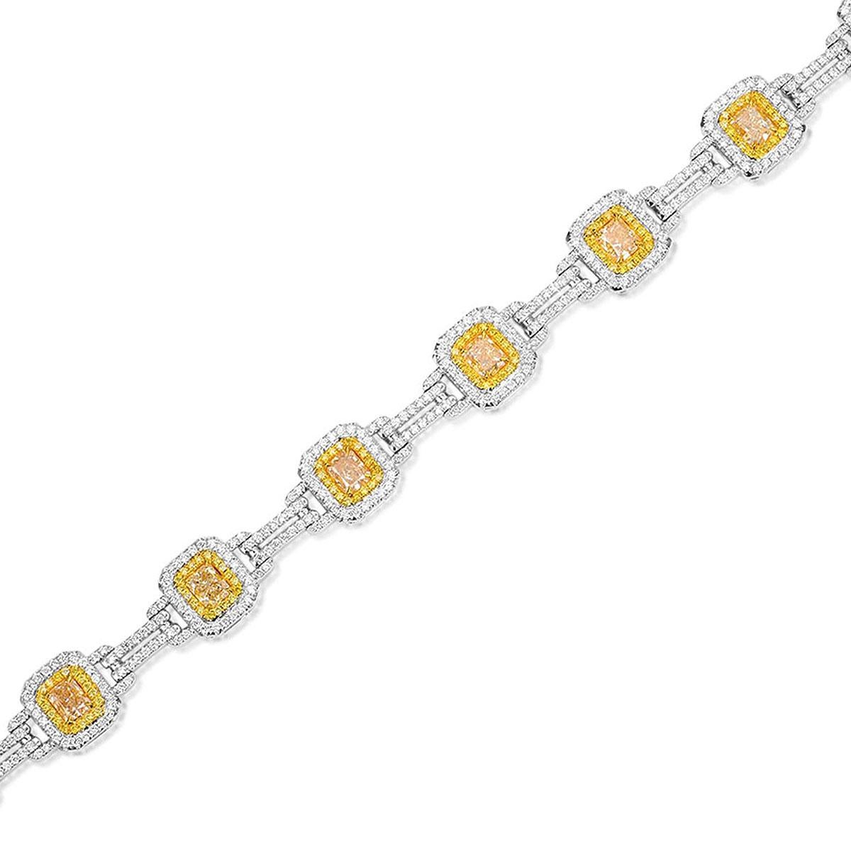 Material: 18k White Gold
Diamond Details: Approximately 7.11ctw of Radiant cut diamonds. Diamonds are fancy yellow in color
Adjacent Diamond Details: Approximately 3.51ctw of round cut diamond. Diamonds are G/H in color and VS in