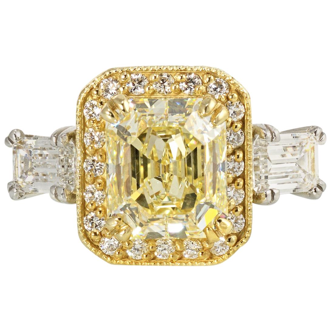 Fancy Yellow Radiant Cut Three-Stone Halo Set Diamond Engagement Ring