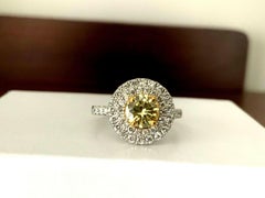 Fancy Yellow Round Brilliant Diamond and Platinum Engagement Ring .82 Carat