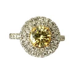 Fancy Yellow Round Brilliant Diamond and Platinum Engagement Ring .82 Carat