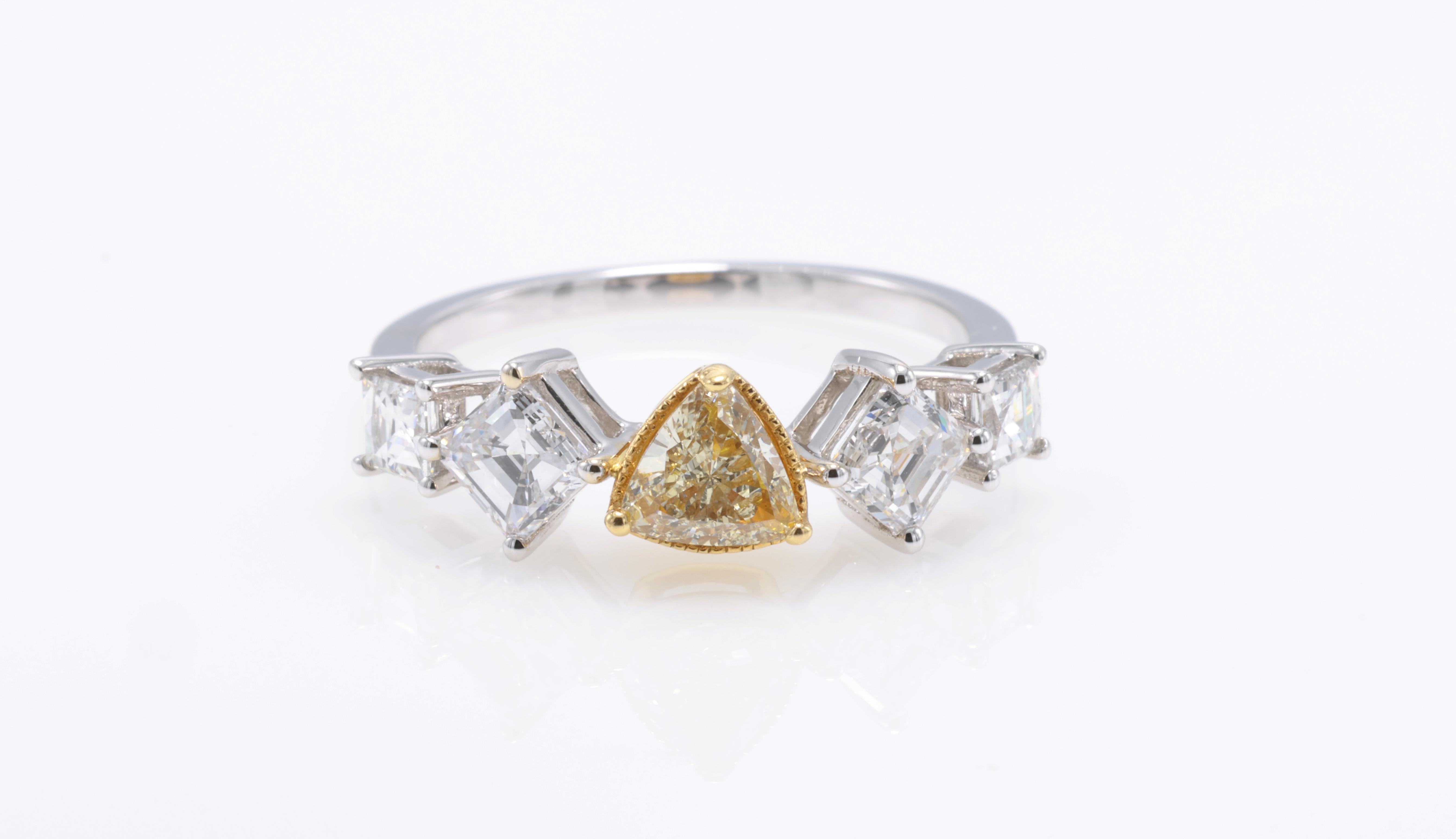 18kt white gold ring with diamonds
  
  Gold colour & karat: White gold 18kt
  Weight: 2.96 grams
  
  Set with-
  Stone type: Diamond
  Shape: Trilliant
  Carat: 0.41 
  Colour: Fancy Yellow
  Clarity: VVS-VS
  
  Surrounding Stones: Diamonds
 1)