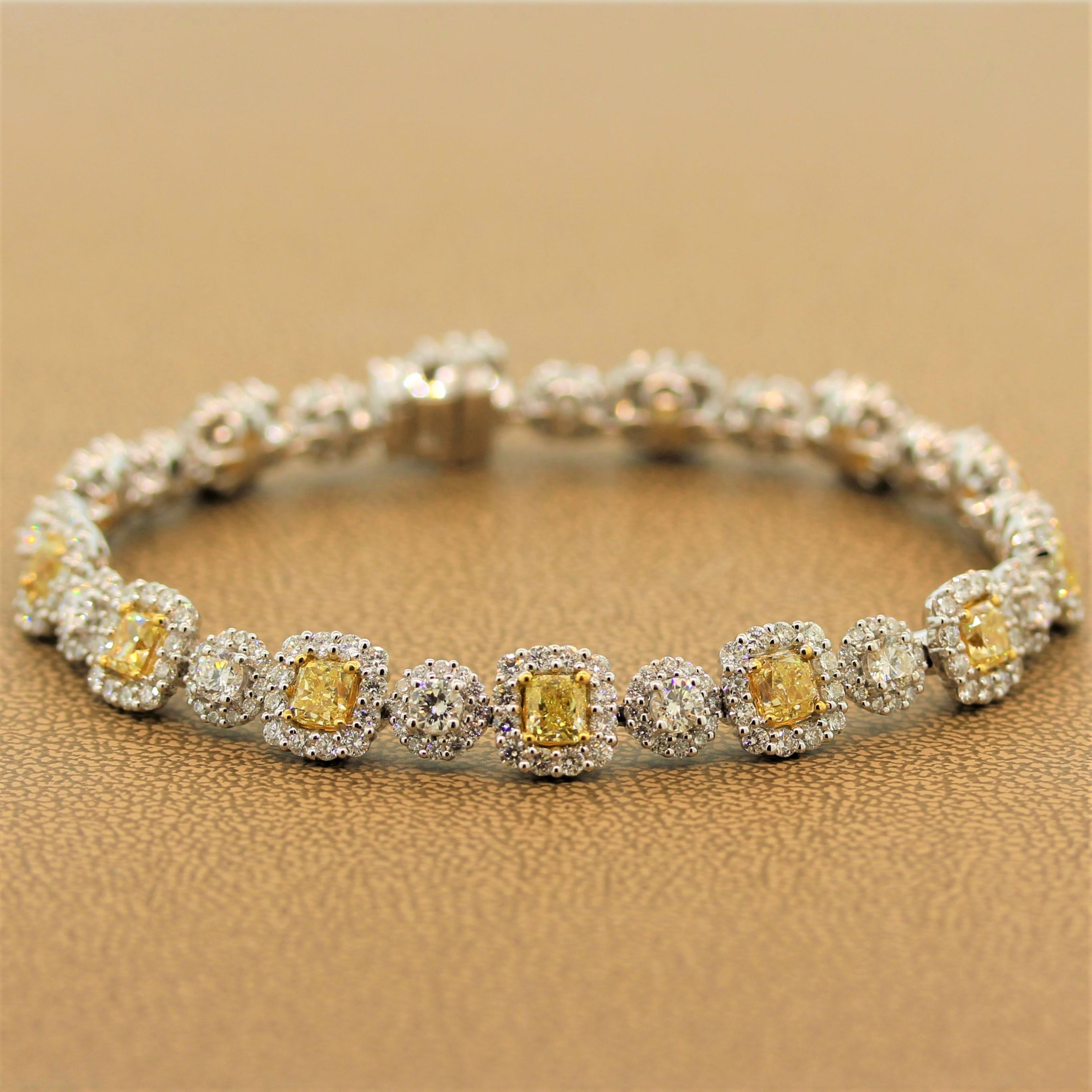 A sleek and sexy tennis bracelet featuring 5.68 carats of fancy yellow cushion cut diamonds, which are enhanced by 7.33 carats of VS quality white diamonds. All set in 18K white gold, the bracelet is blanketed in sparkling diamonds that dance in the