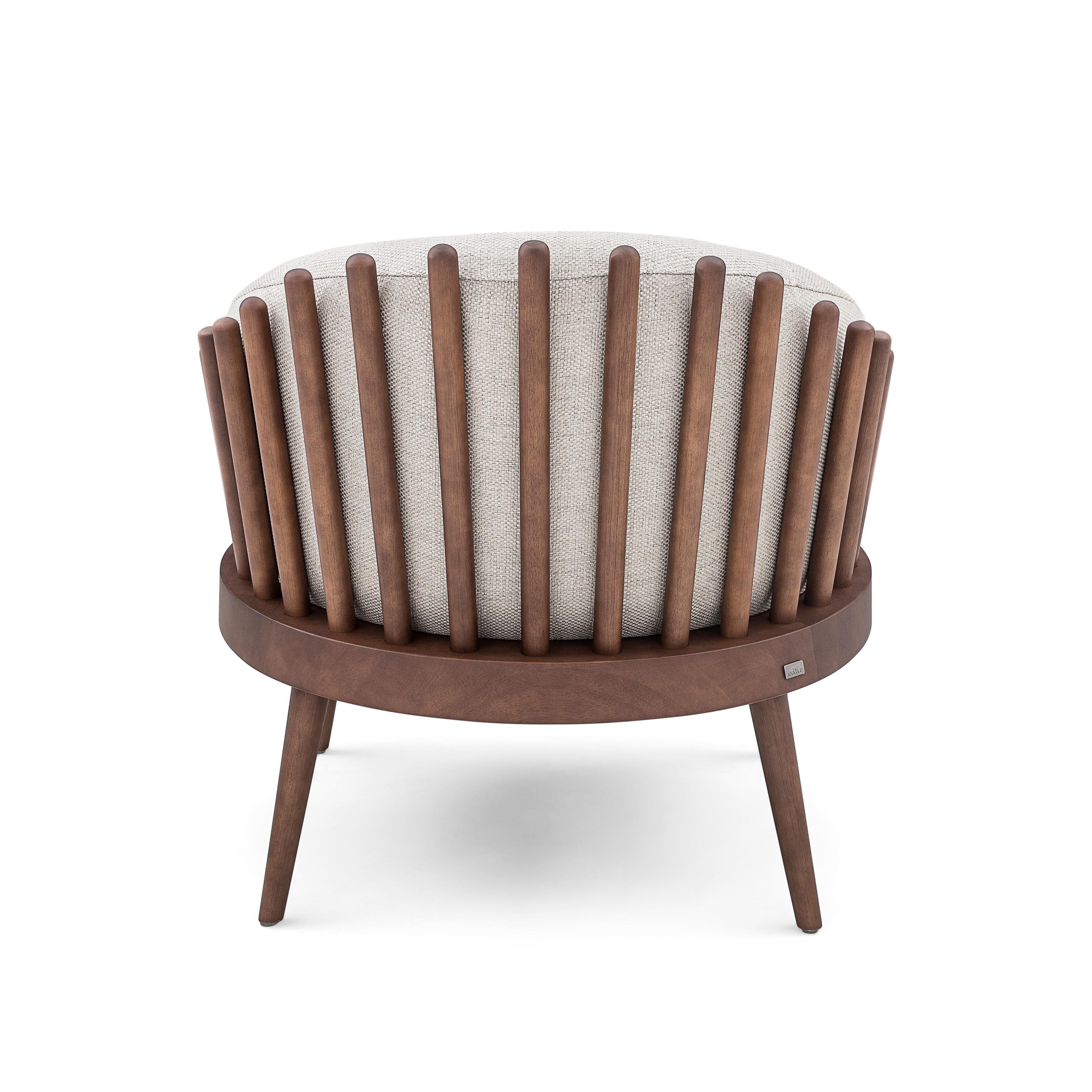 The Uultis design team has created this beautiful Fane armchair, upholstered with a beautiful and soft off-white fabric, feature with a walnut wood finish. This beautiful creation will provide a perfect comfortable space with its cushion seat and