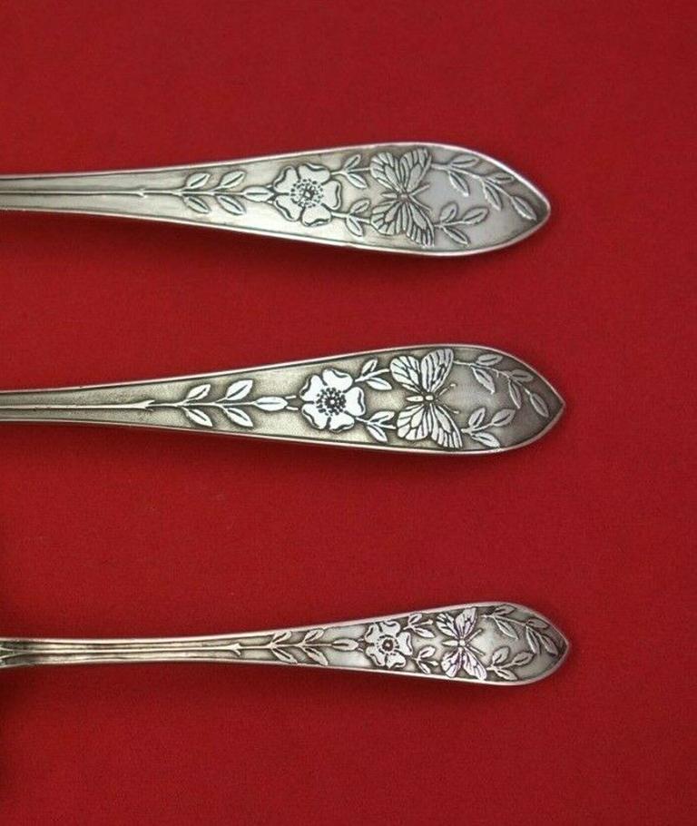 Sterling silver child's set 3-piece with butterflies and flowers in the pattern Faneuil acid etched by Tiffany & Co. This set includes:

1 - Baby food pusher, 4