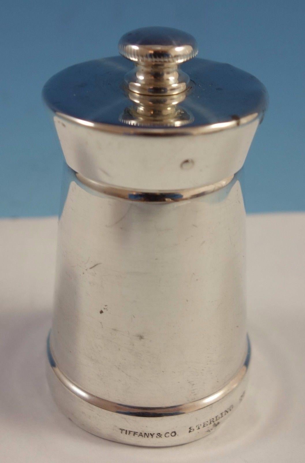 Faneuil by Tiffany & Co. sterling silver small salt shaker with pepper mill. The salt Shaker is marked with #579, and the pepper mill is marked with #27. The salt Shaker measures 1 1/2