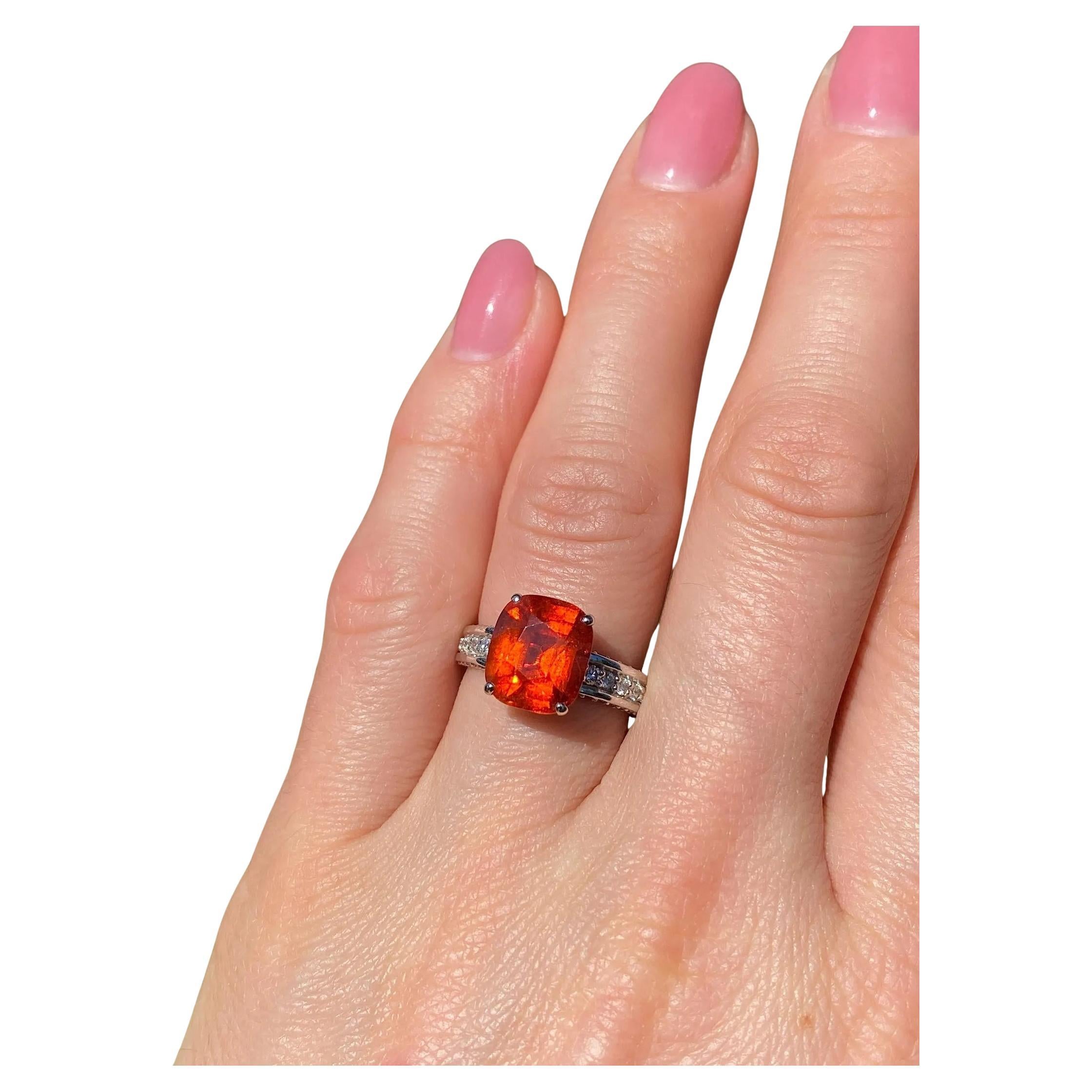Natural Spessartite and Diamonds gemstone
14 Karat White Gold Ring

GFCO Certificate for Spessartite Garnet
Laboratory full certificate for the ring.
Main Stone: Garnet Spessartite
Main Stone Creation: Natural
Main Stone Color: Orange Fanta
Main