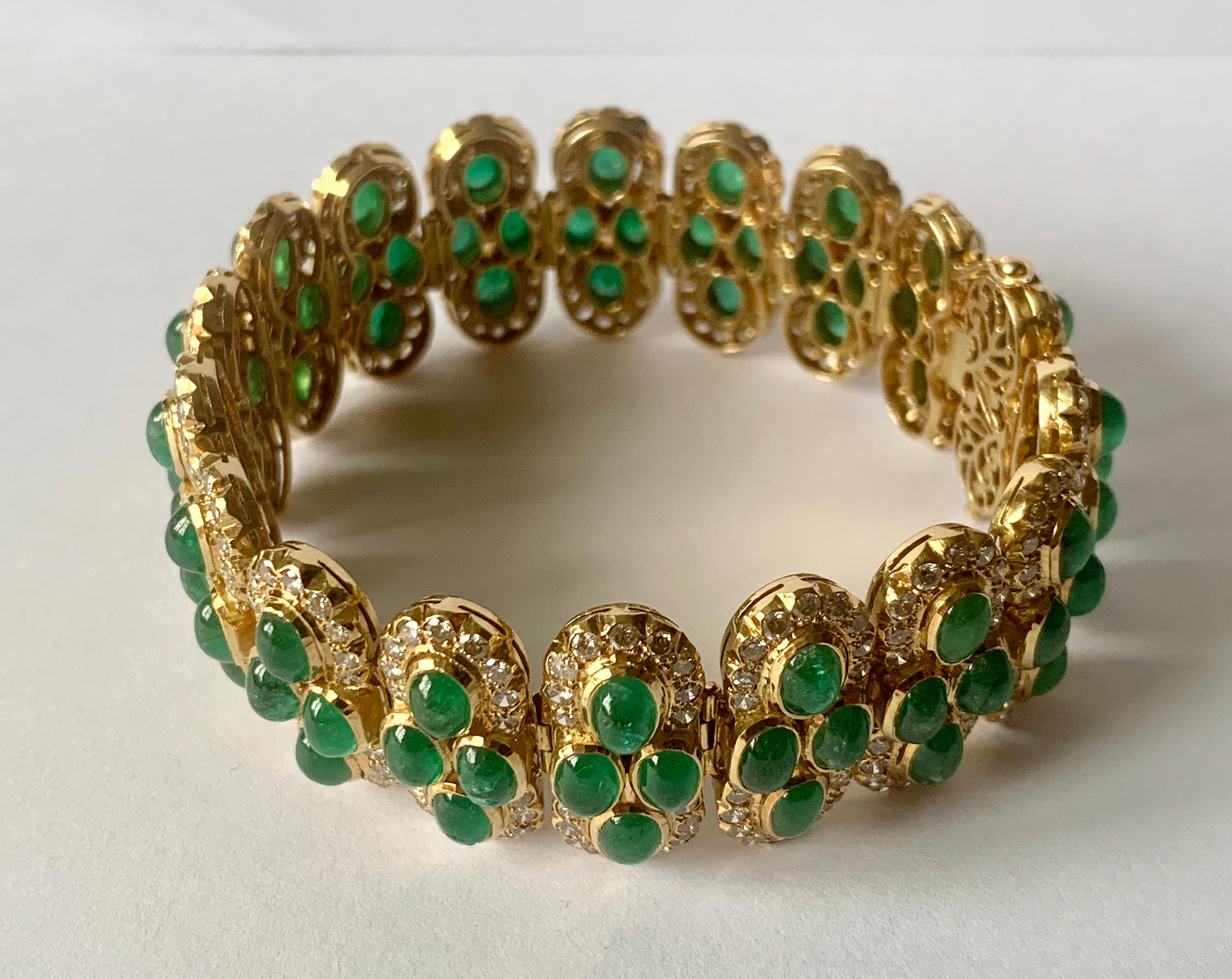 Amazing Indian inspired link bracelet in 18 K yellow Gold. Studded by 72 Emerald Cabochons with an estimated weight of ca. 21 ct, and additionally adorned with 324 brilliant cut Diamonds of ca. 6.50 ct, G color, si clarity. 
Length 18 ct.   71.59
