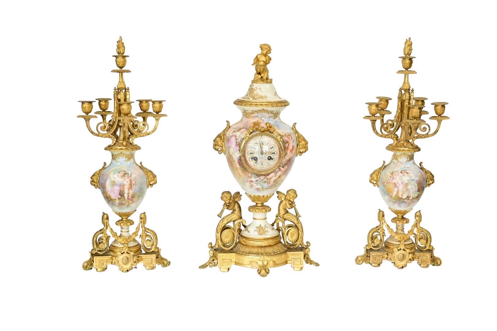 This is a stunning 19th Century Tiffany & Co Bronze Clock Set that is beautifully hand-painted with exquisite detail. This clock set is made with beautiful bronze and porcelain that adds a touch of luxury to any room. It is perfect for collectors