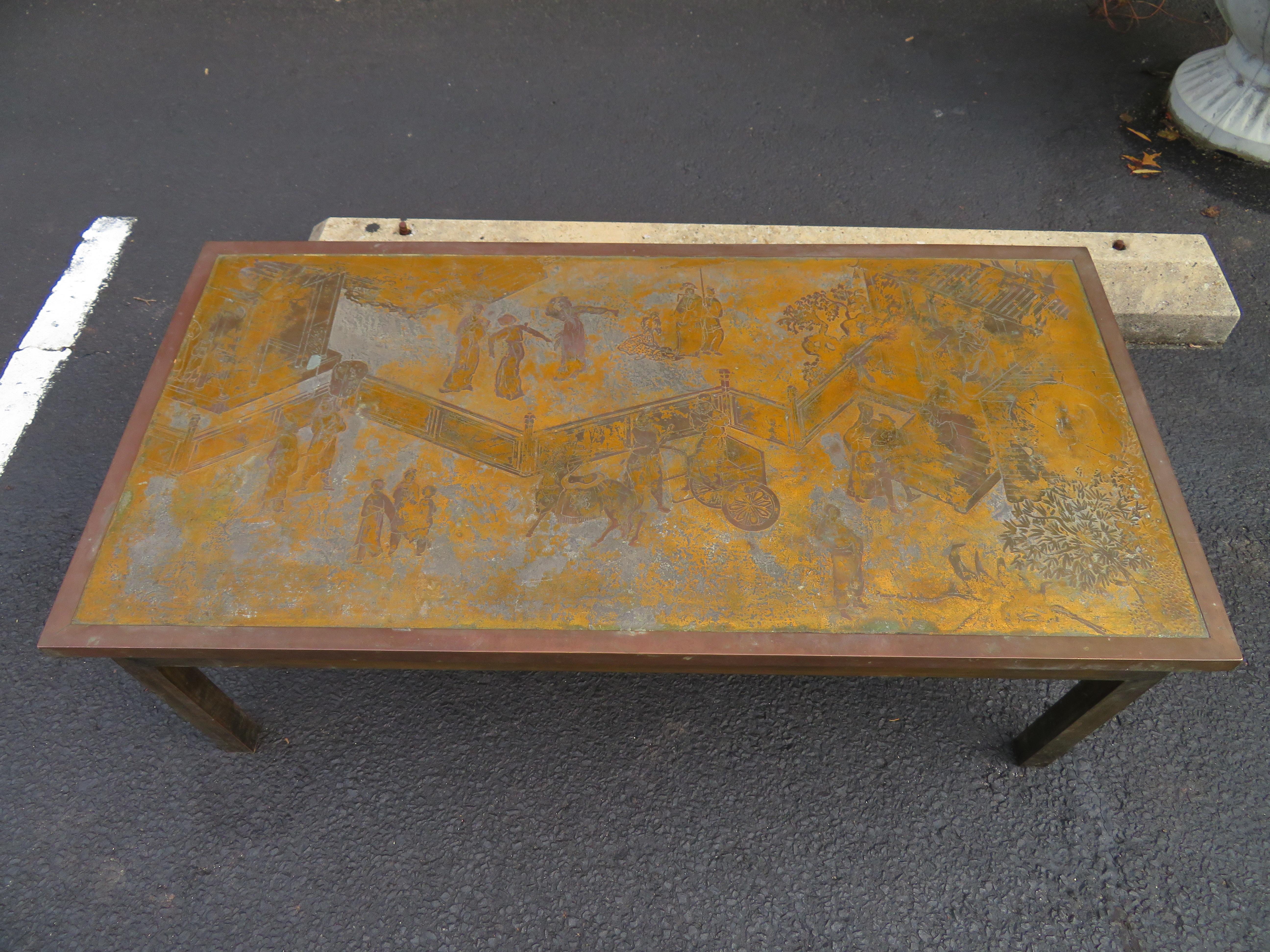 Fantastic acid etched Asian inspired coffee table, made by Phillip and Kelvin Laverne, American, circa 1970s. We love the gold and bronze colored patina mixed with shades of pewter and grey-very unusual!
