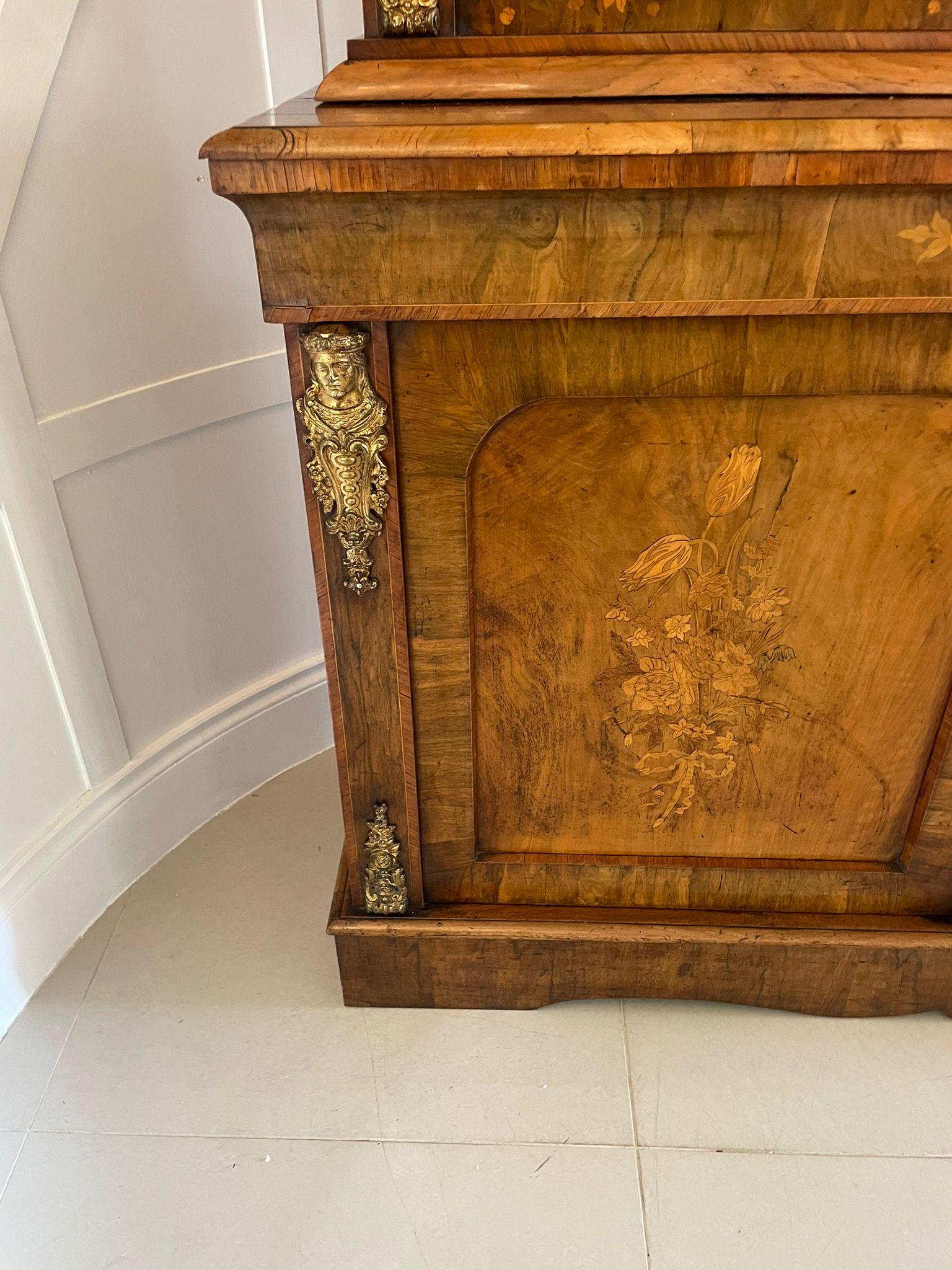 Outstanding quality antique Victorian burr walnut marquetry inlaid ormolu mounted bookcase cabinet having a quality moulded cornice above a pair of pretty burr walnut floral marquetry inlaid glazed doors opening to reveal three adjustable shelves