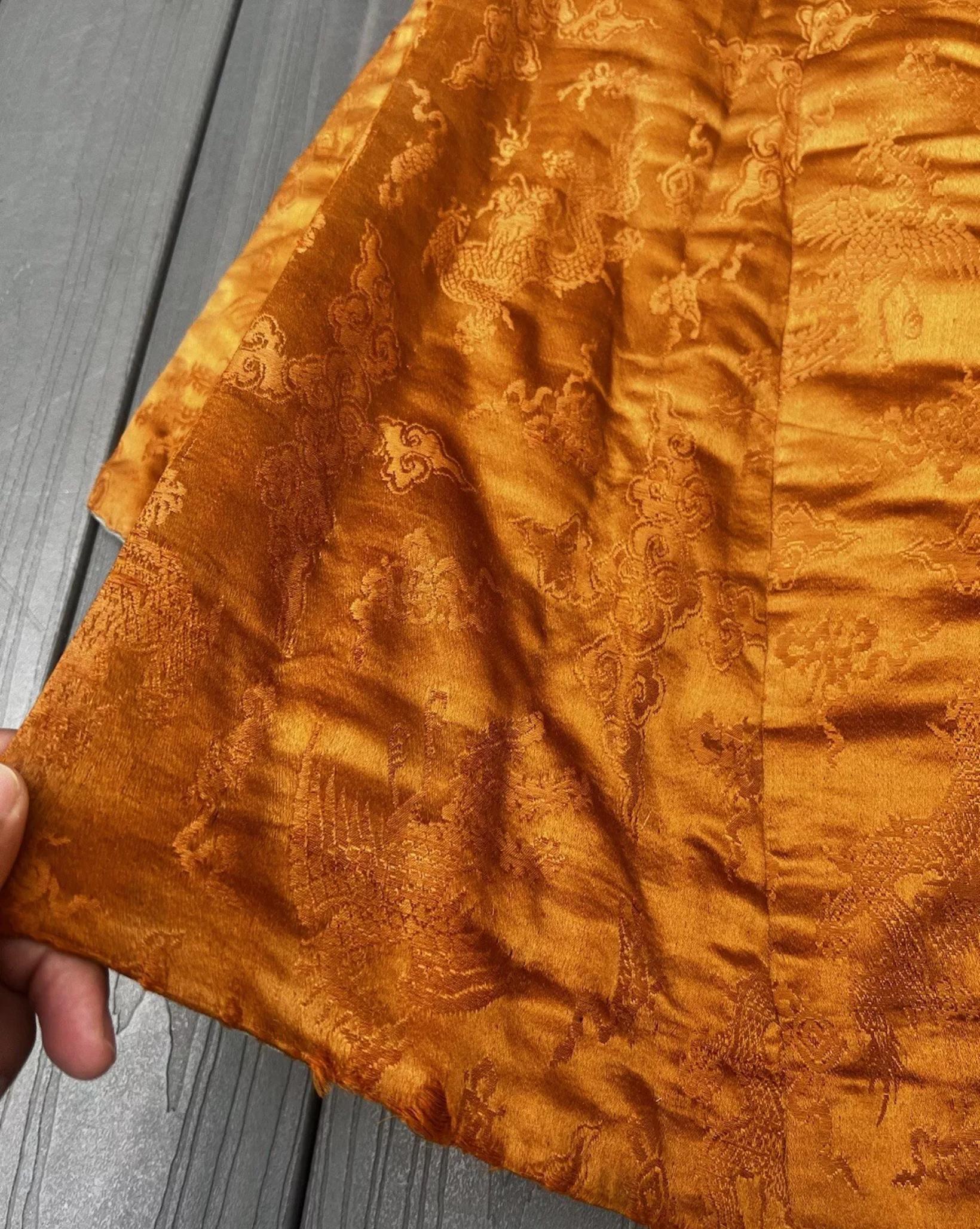 Absolutely amazing amber colored damask Chinese silk full length Tibetan chuba. Dragons, phoenix, and auspicious symbols are woven throughout.


This is very heavy! Very well made! I imagine it would be very warm when worn on a chilly day. It is