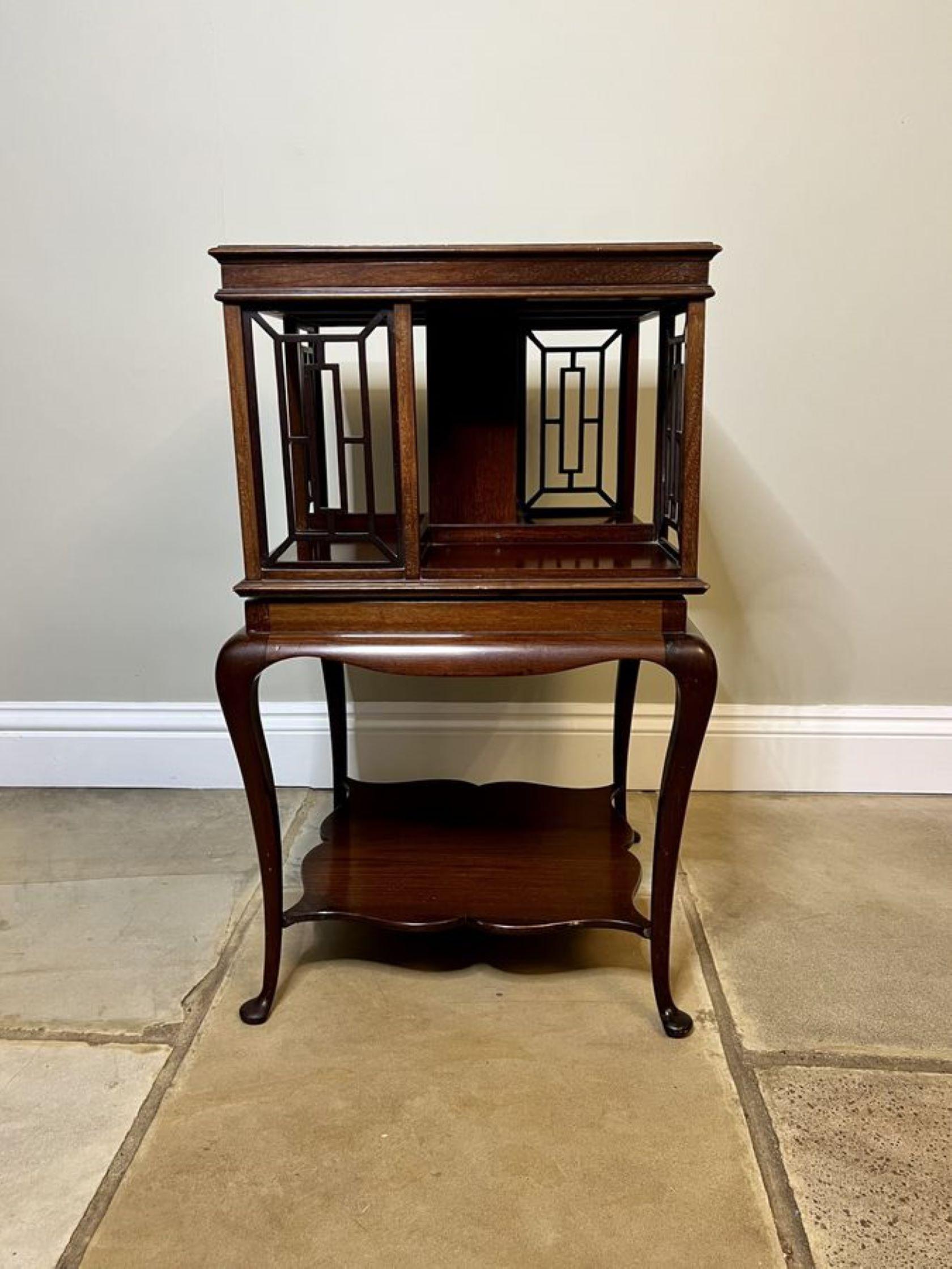 Fantastic antique Edwardian mahogany revolving bookcase, having a quality mahogany top with a moulded edge above four carved fretwork supports and four storage compartments, the revolving bookcase is supported by elegant shaped cabriole legs with
