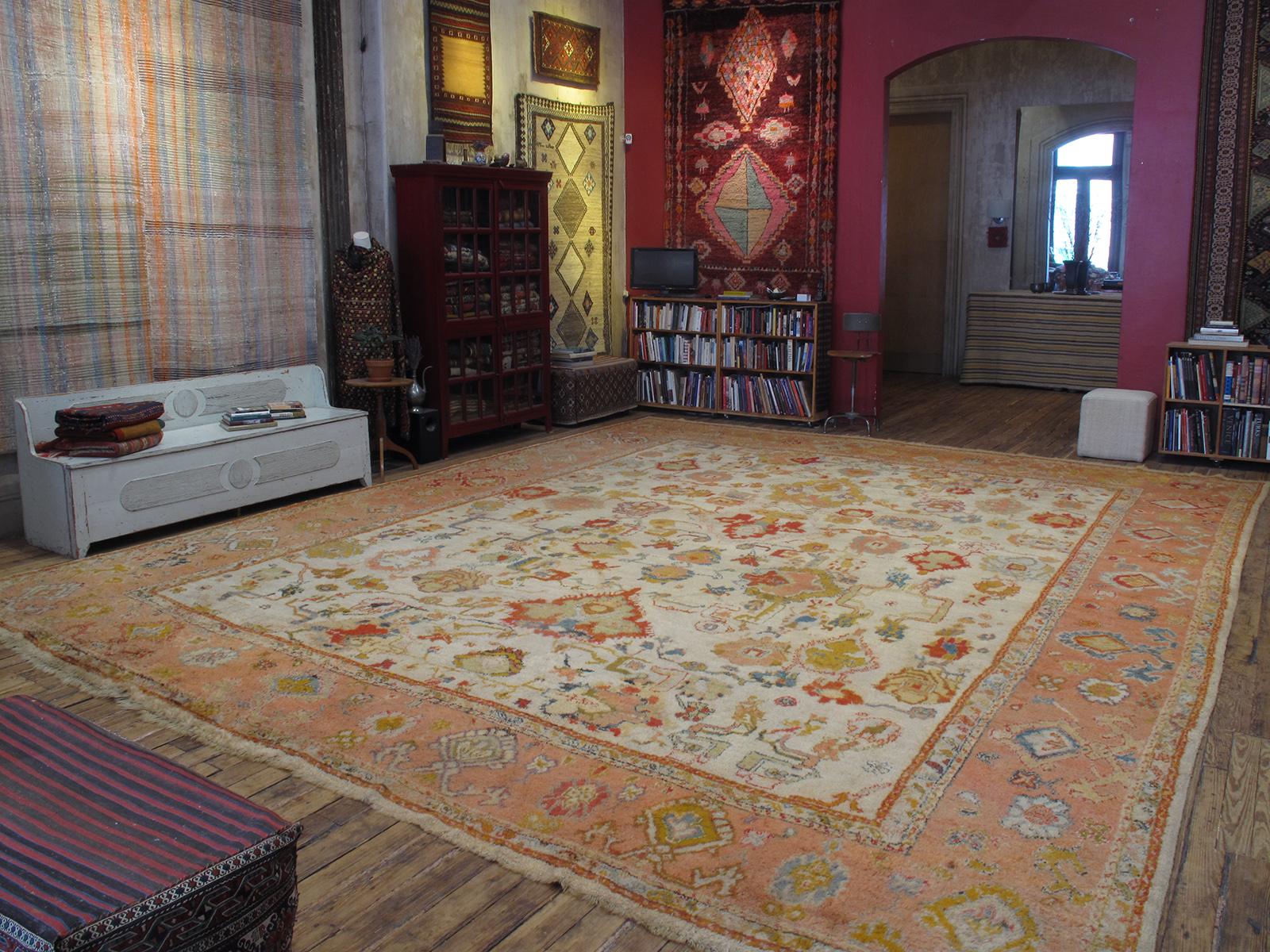 A fantastic, oversize antique Oushak carpet. The real deal, the genuine article, the kind that built the legend of Oushak.

The best examples, like this one, display a lighthearted, playful, almost impressionistic take on classical Persian designs: