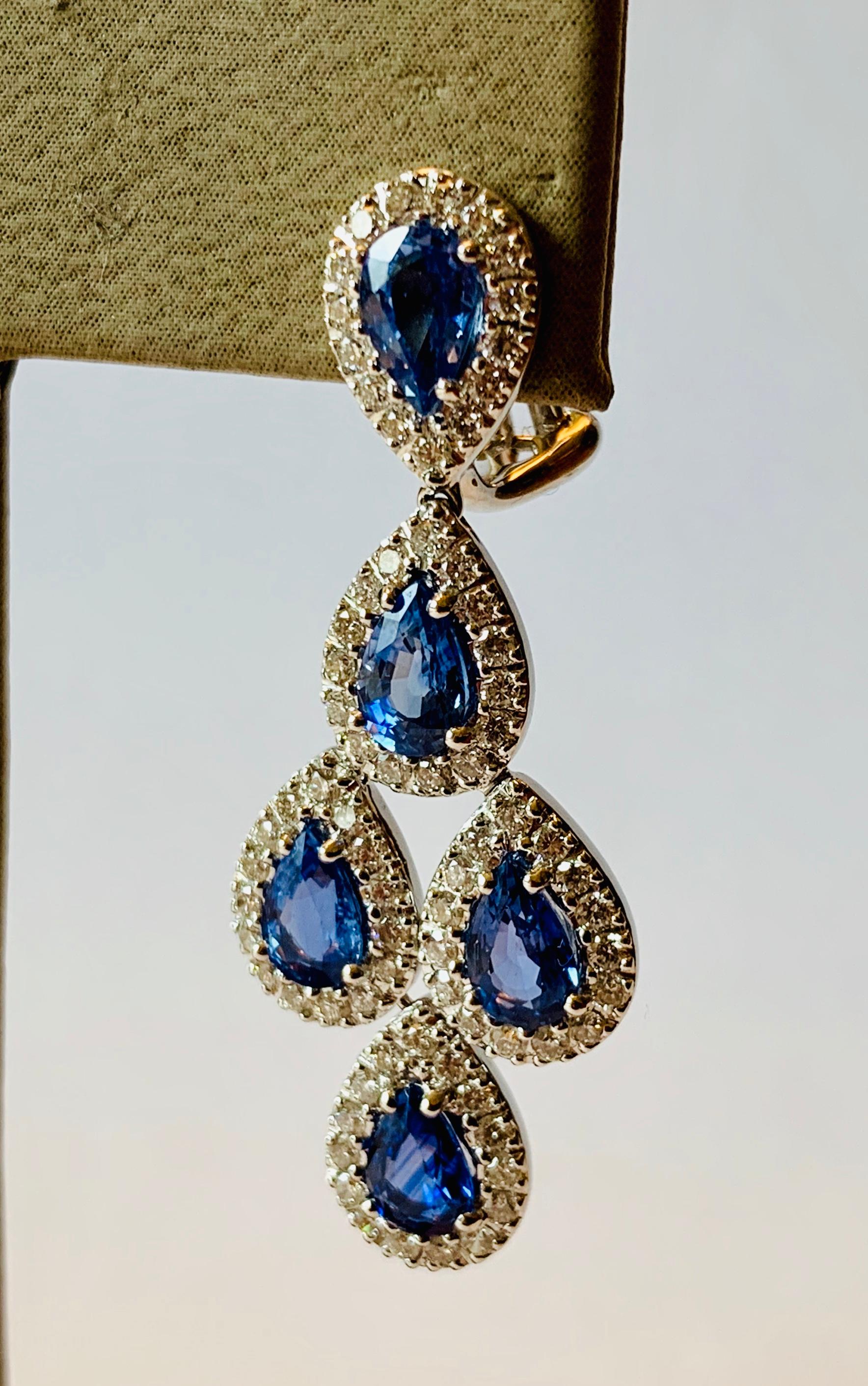 Sophisticated elegance! These earrings feature 10 pear shape blue Sapphires weighing 4.82 ct., accented by 150 brilliant cut Diamonds totaling 1.50 ct, G, vs. These chandelier drop earrings are set in 18K white gold with omega clip backings.