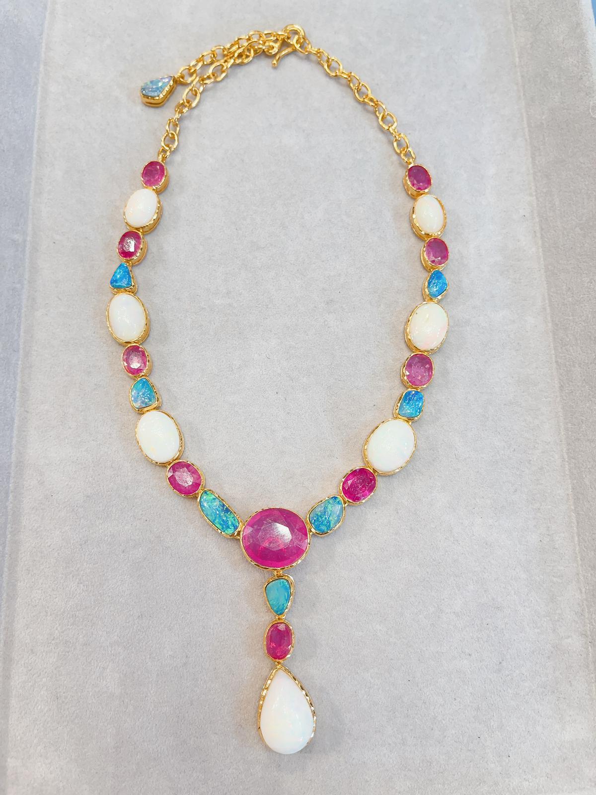 Bochic “Capri” Multi Natural Gem Necklace
Natural Ruby, Colors - Red, Pink - 35 Carats 
Shape - Oval shape 
Ethiopian White Opal and Australian Blue Opal - 34 Carats 
Shape - oval shape 
Shape - large pear shape at the drop 
Set in 22K Gold and