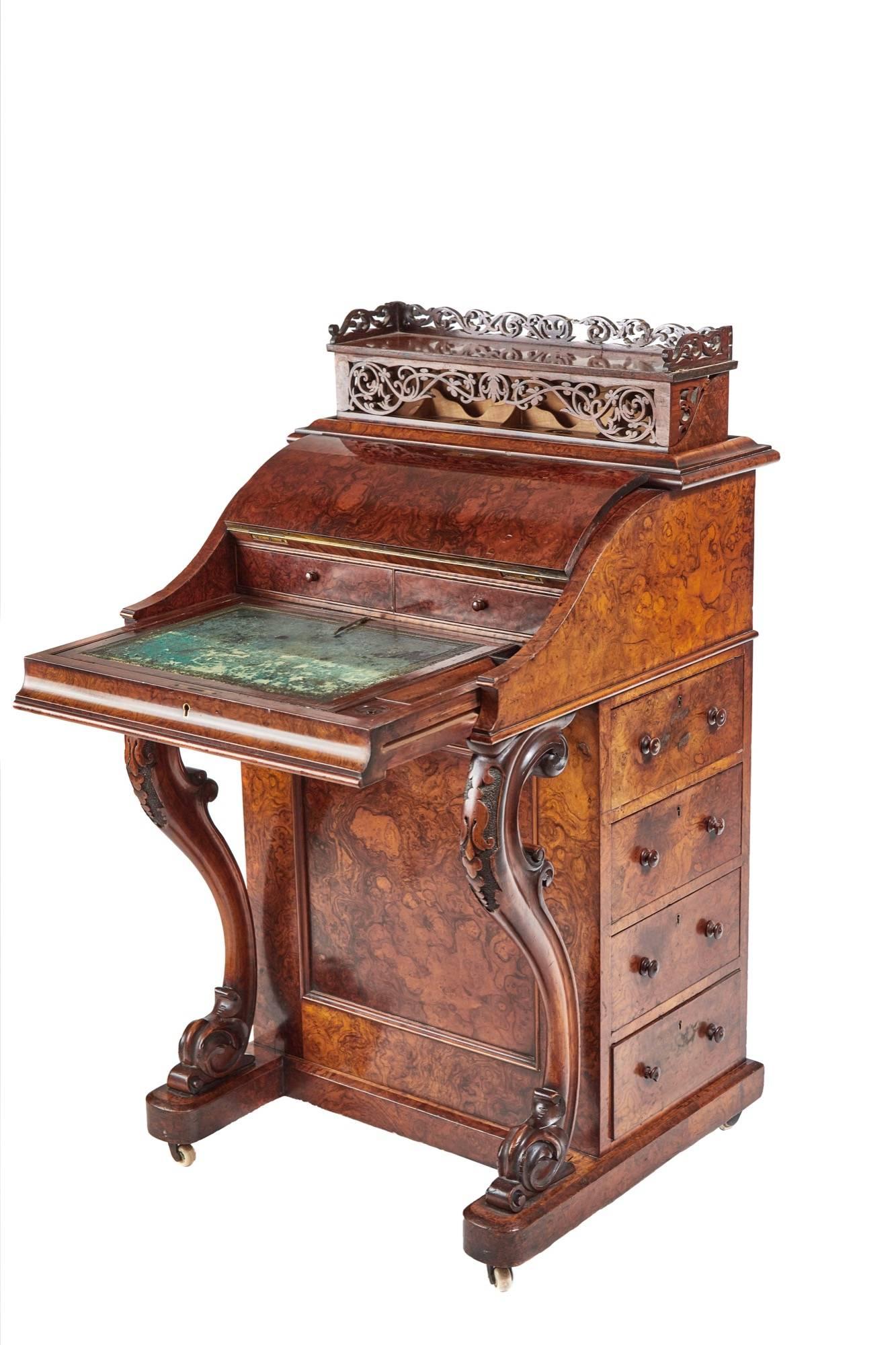 A fantastic burr walnut piano top Davenport, with a pop up top, and a pull-out writing slide with the original tooled leather writing surface fitted lidded pen and ink boxes, secret button to release sprung top with a fantastic fretwork panel