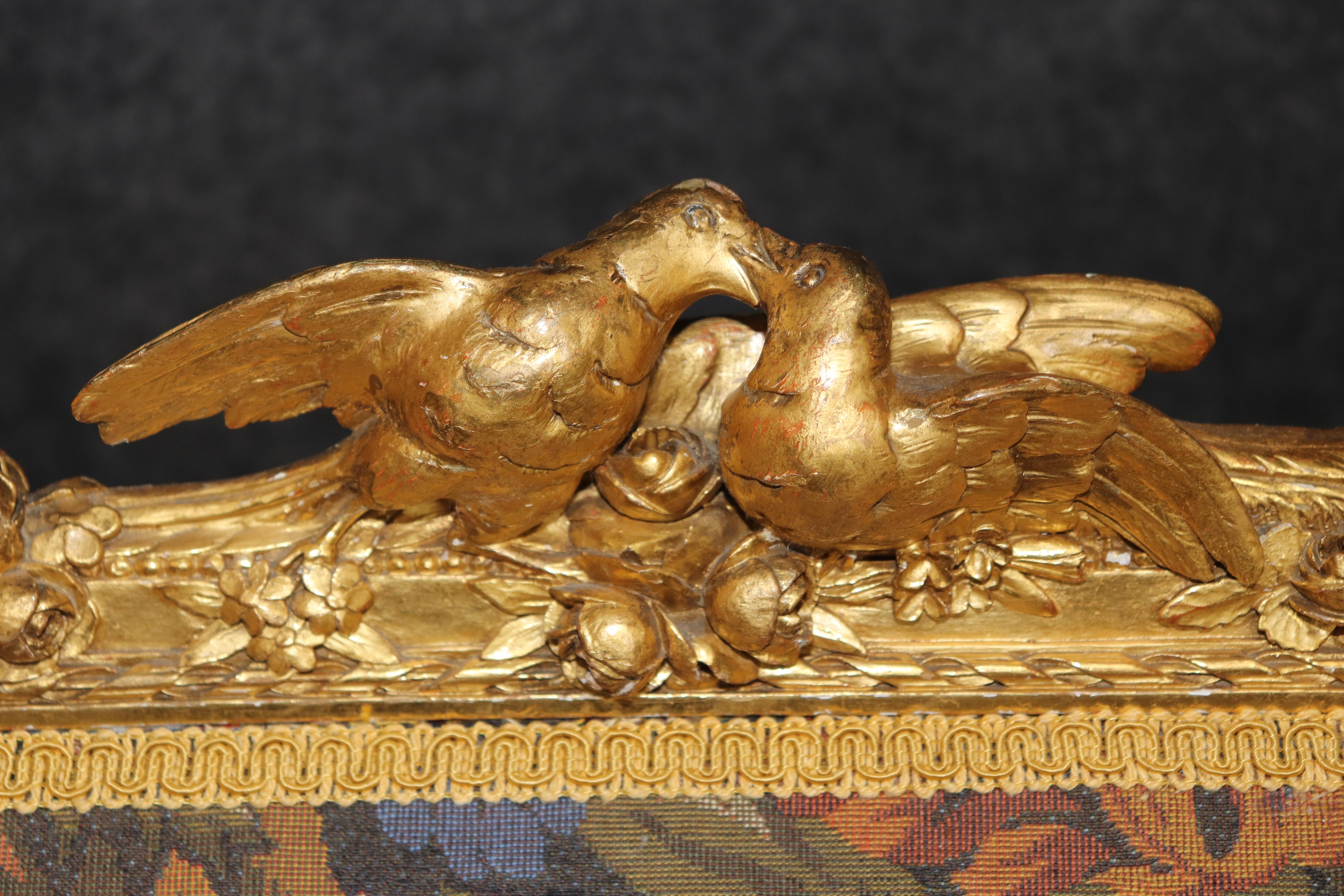 This is a spectacular settee that is part of a full salon set with 2 pairs of identical armchairs listed separately as pairs. The finish and carving is extraordinary and naturalistic. The upholstery is recently re-done ad still good. Because the