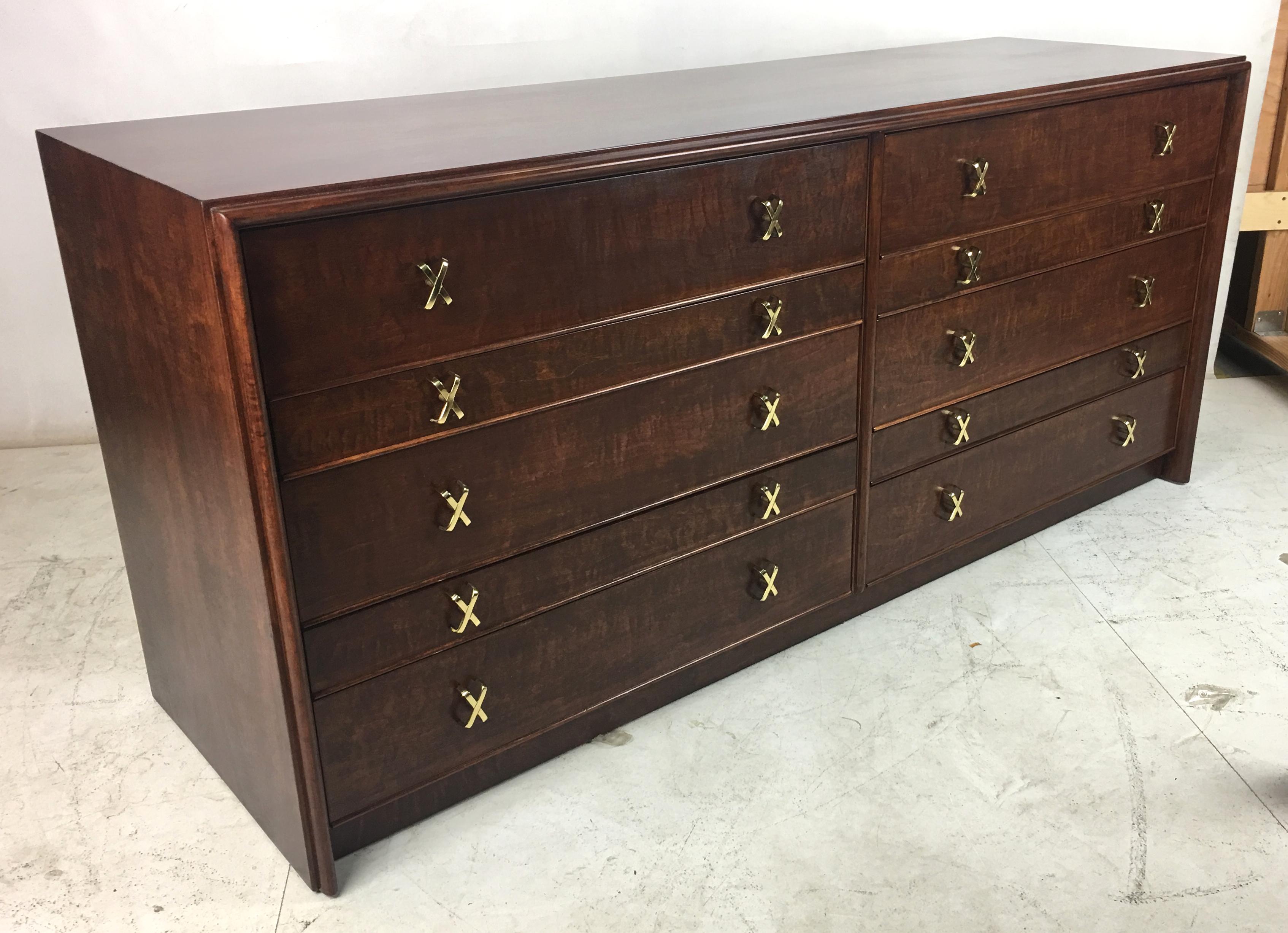 Spectacularly grained curly maple dresser by Paul Frankl for Johnson (sold through John Stuart, Inc.-NY). The piece has been painstakingly restored and refinished and the hardware has been professionally polished and lacquered. The cabinet is made
