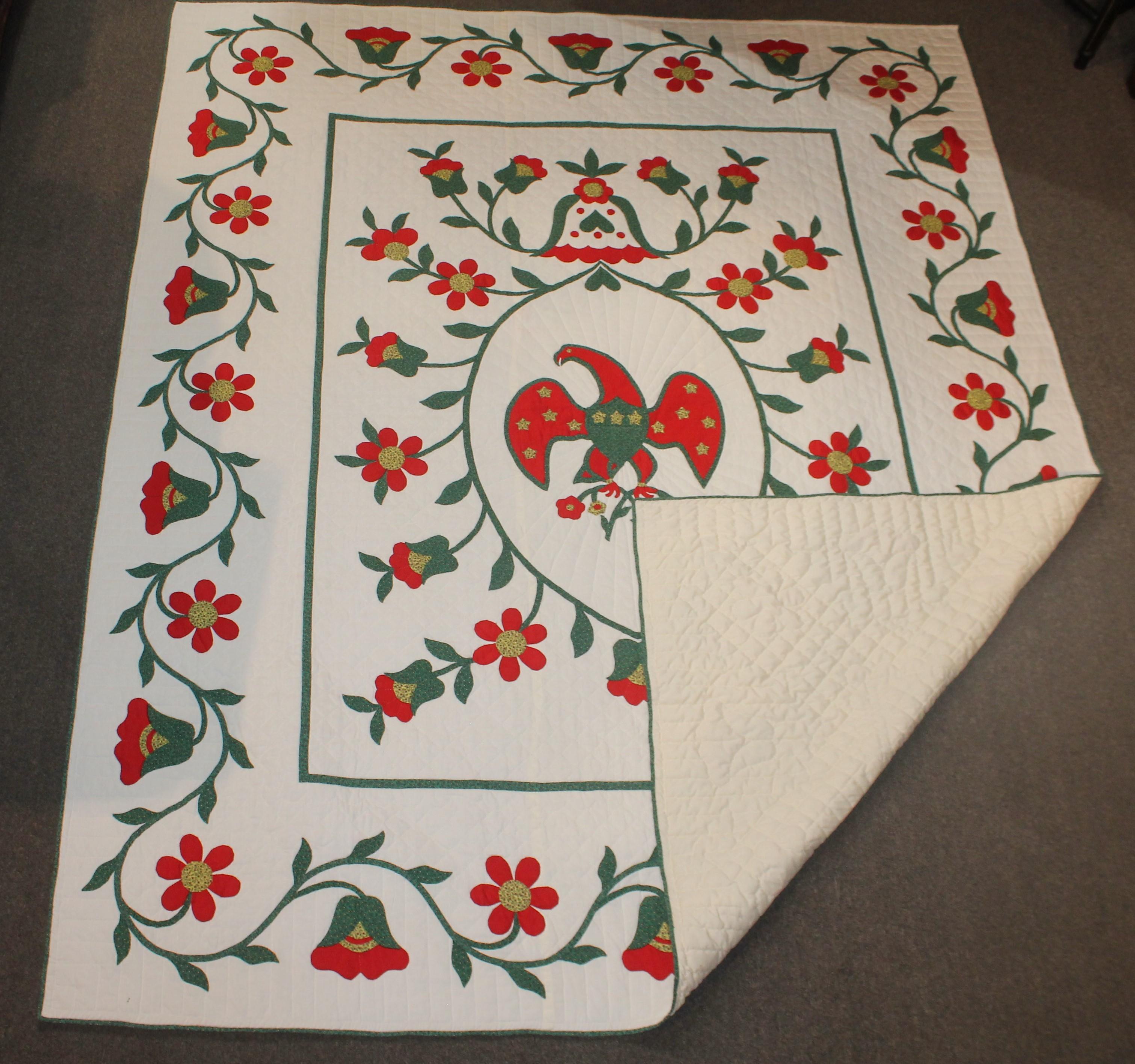 Fantastic eagle applique quilt with a wonderful tulip and vine border. The condition is very good. It is amazing and graphic. This quilt is from Lancaster County, Pennsylvania.