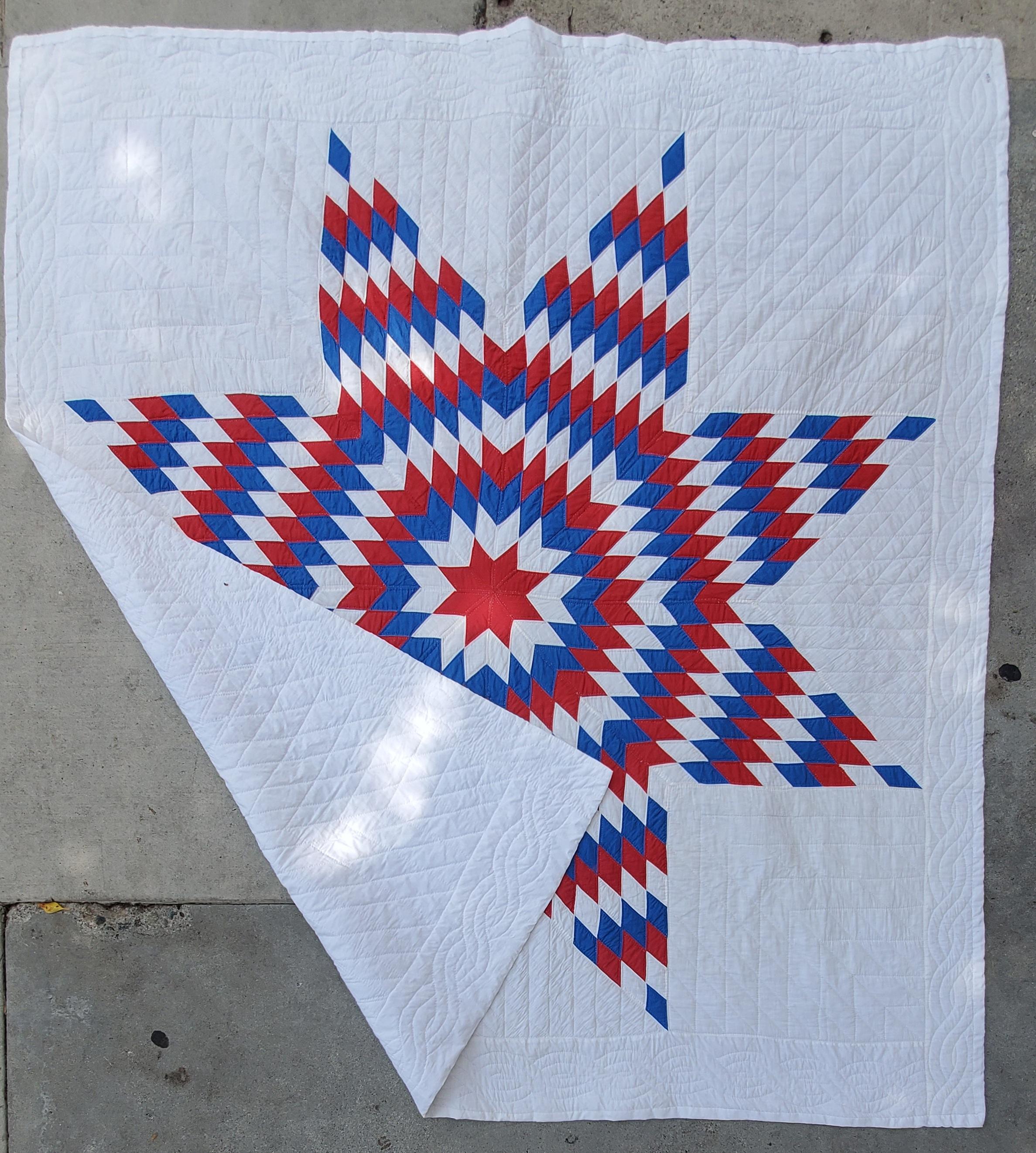 This wonderful and graphic red, white and blue patriotic quilt is in pristine condition. It was recently laundered and has very fine piecework and quilting.