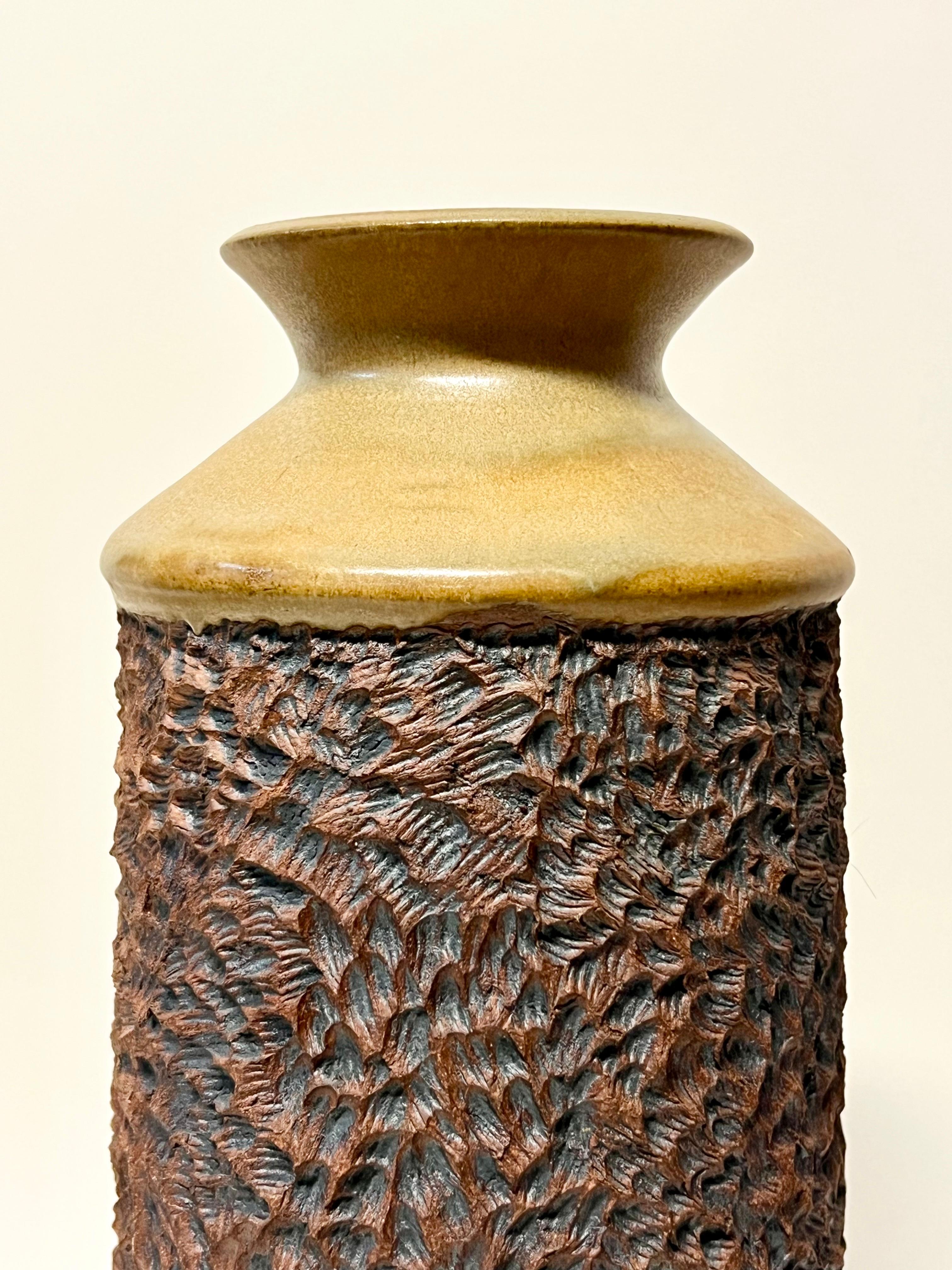 Stunning early vase by noted ceramicist, Anne Goldman c1970s, California. Goldman's work is wheel-thrown stoneware with carved, sculpted, and pierced surfaces enhanced with porcelain and iron slips. Her work is represented extensively in galleries,